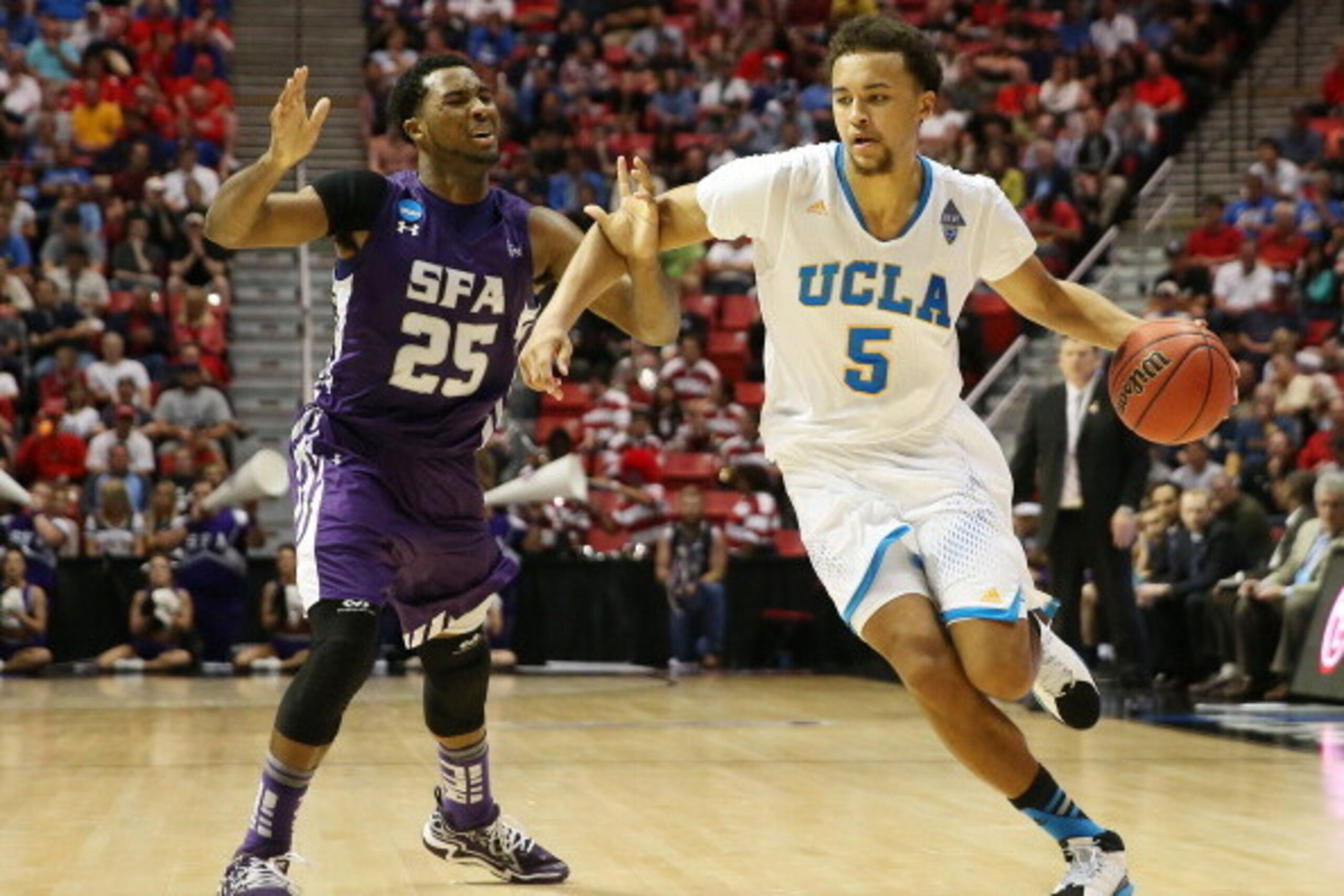 SAN DIEGO, CA - MARCH 23:  Kyle Anderson #5 of the UCLA Bruins drives against Desmond Haymon #25 of the Stephen F. Austin Lumberjacks in the second half during the third round of the 2014 NCAA Men's Basketball Tournament at Viejas Arena on March 23, 2014
