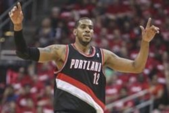 Apr 20, 2014; Houston, TX, USA; Portland Trail Blazers forward LaMarcus Aldridge (12) celebrates after scoring during the first quarter against the Houston Rockets in game one during the first round of the 2014 NBA Playoffs at Toyota Center. Mandatory Cre