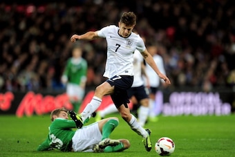 LONDON, ENGLAND - NOVEMBER 19:  Adam Lallana of England is tackled by Toni Kroos of Germany  during the international friendly match between England and Germany at Wembley Stadium on November 19, 2013 in London, England.  (Photo by Shaun Botterill/Getty I