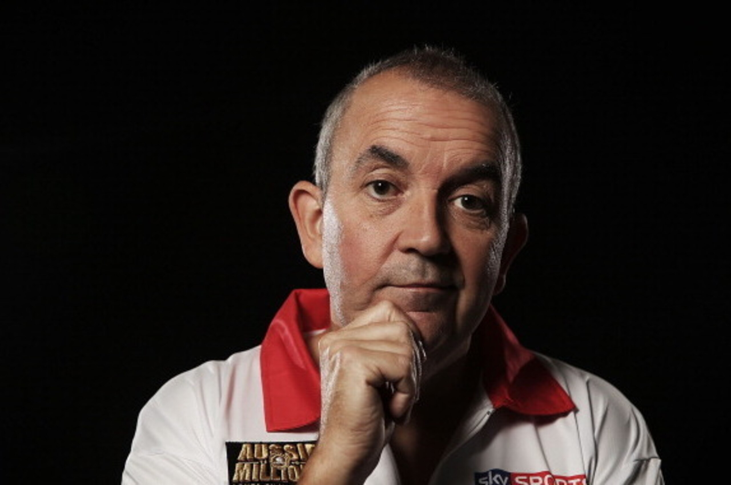 SYDNEY, AUSTRALIA - AUGUST 29:  (EDITORS NOTE: Image has been desaturated) Phil Taylor poses for a portrait ahead of the Sydney Darts Masters at Luna Park on August 29, 2013 in Sydney, Australia.  (Photo by Mark Metcalfe/Getty Images)