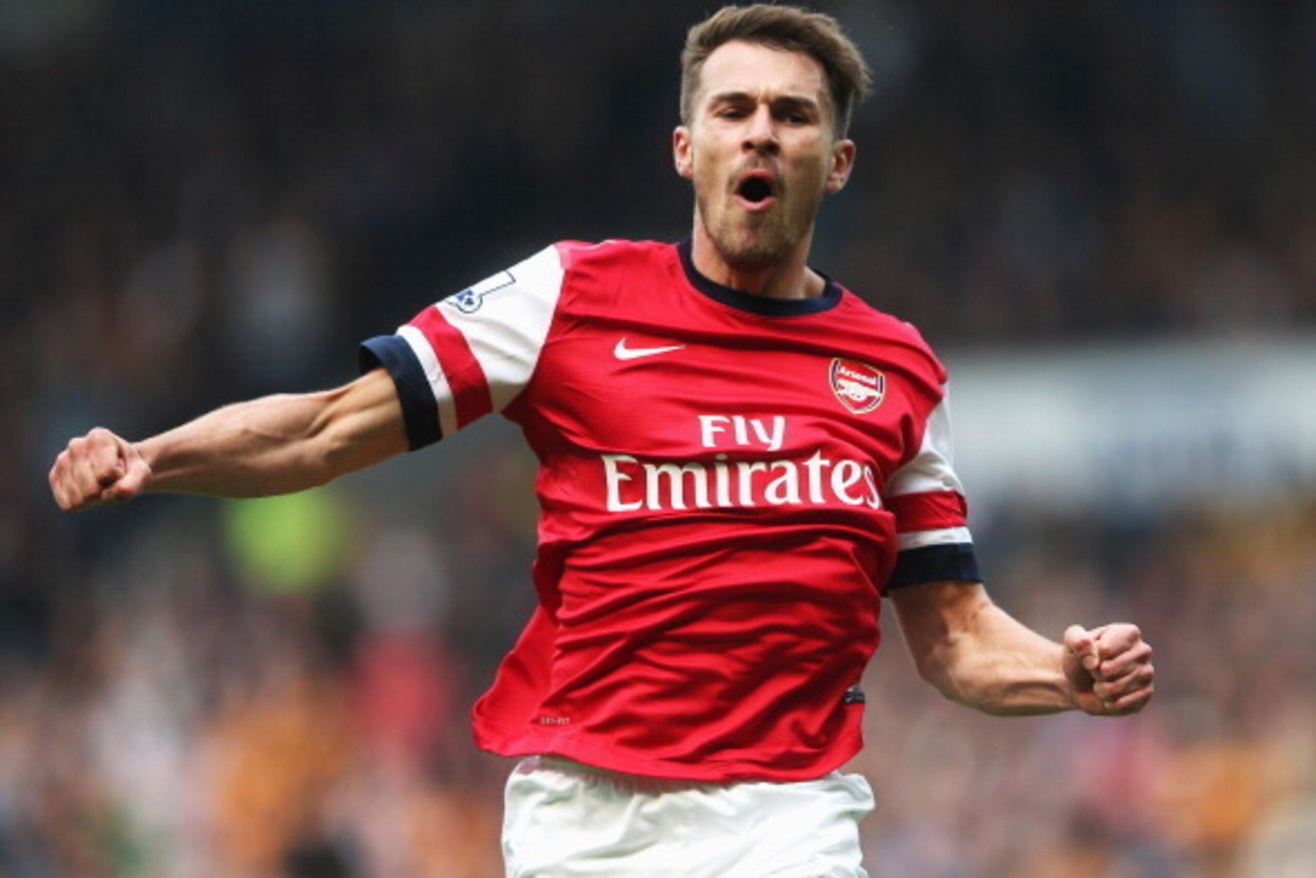 HULL, ENGLAND - APRIL 20:  Aaron Ramsey of Arsenal celebrates scoring his sides first goal during the Barclays Premier League match between Hull City and Arsenal at KC Stadium on April 20, 2014 in Hull, England.  (Photo by Scott Heavey/Getty Images)
