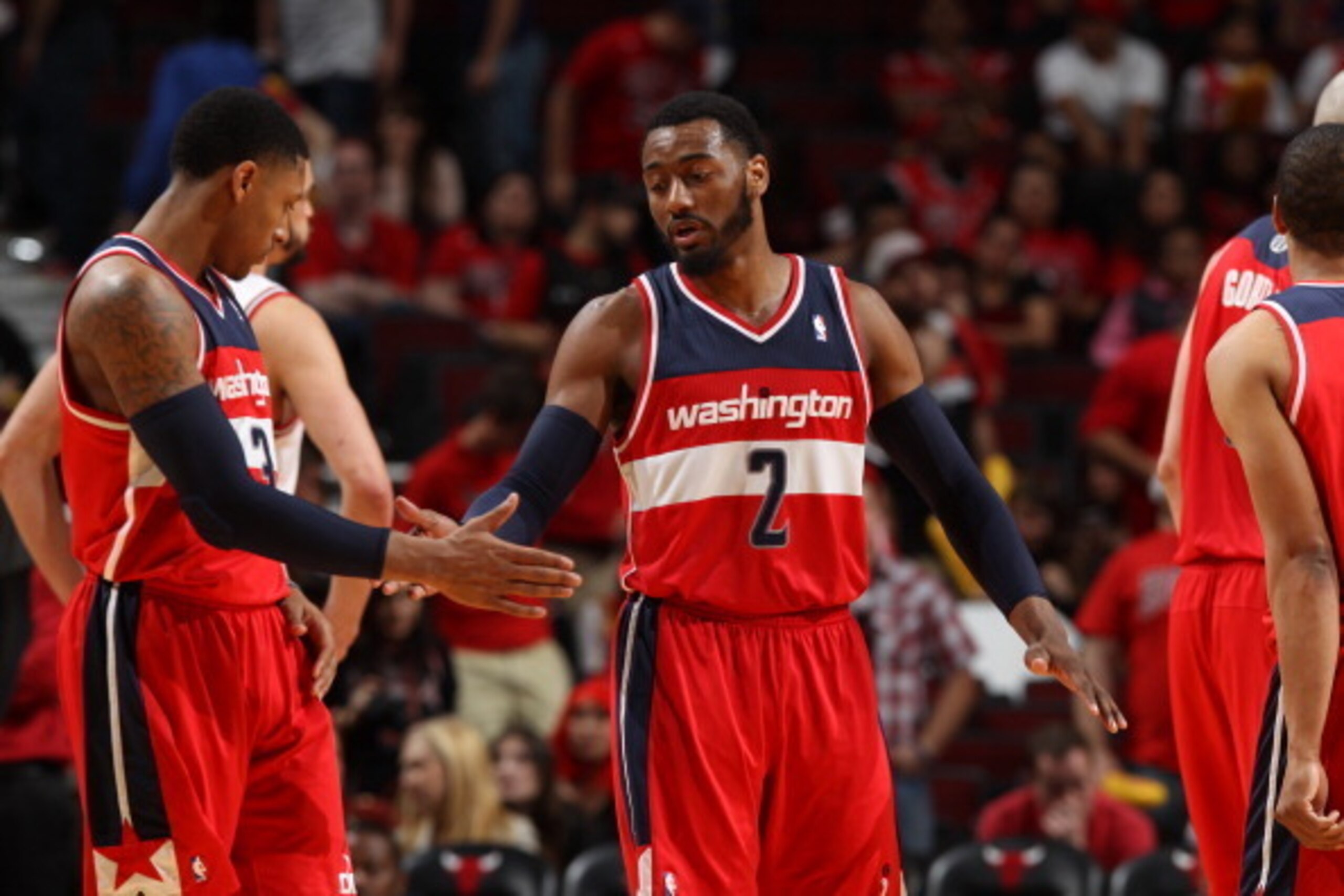 CHICAGO, IL  APRIL 20: John Wall #2 and Bradley Beal #3 of the Washington Wizards slap hands during a game against the Chicago Bulls during Game 1 of the Eastern Conference Quarterfinals on April 20, 2014 at the United Center in Chicago, Illinois. NOTE TO