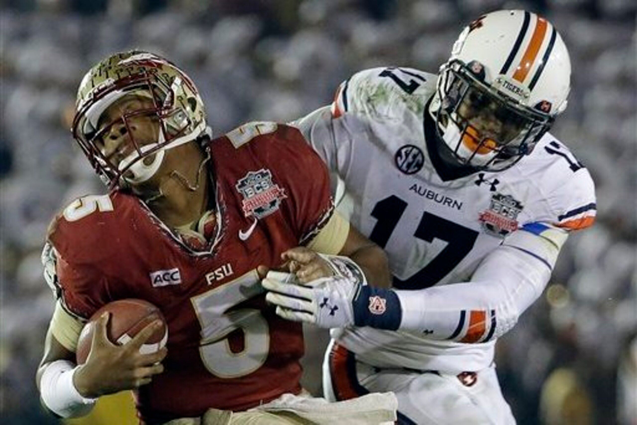 Auburn LB Kris Frost (17) tackles Florida State QB Jameis Winston in the 2014 BCS National Championship Game