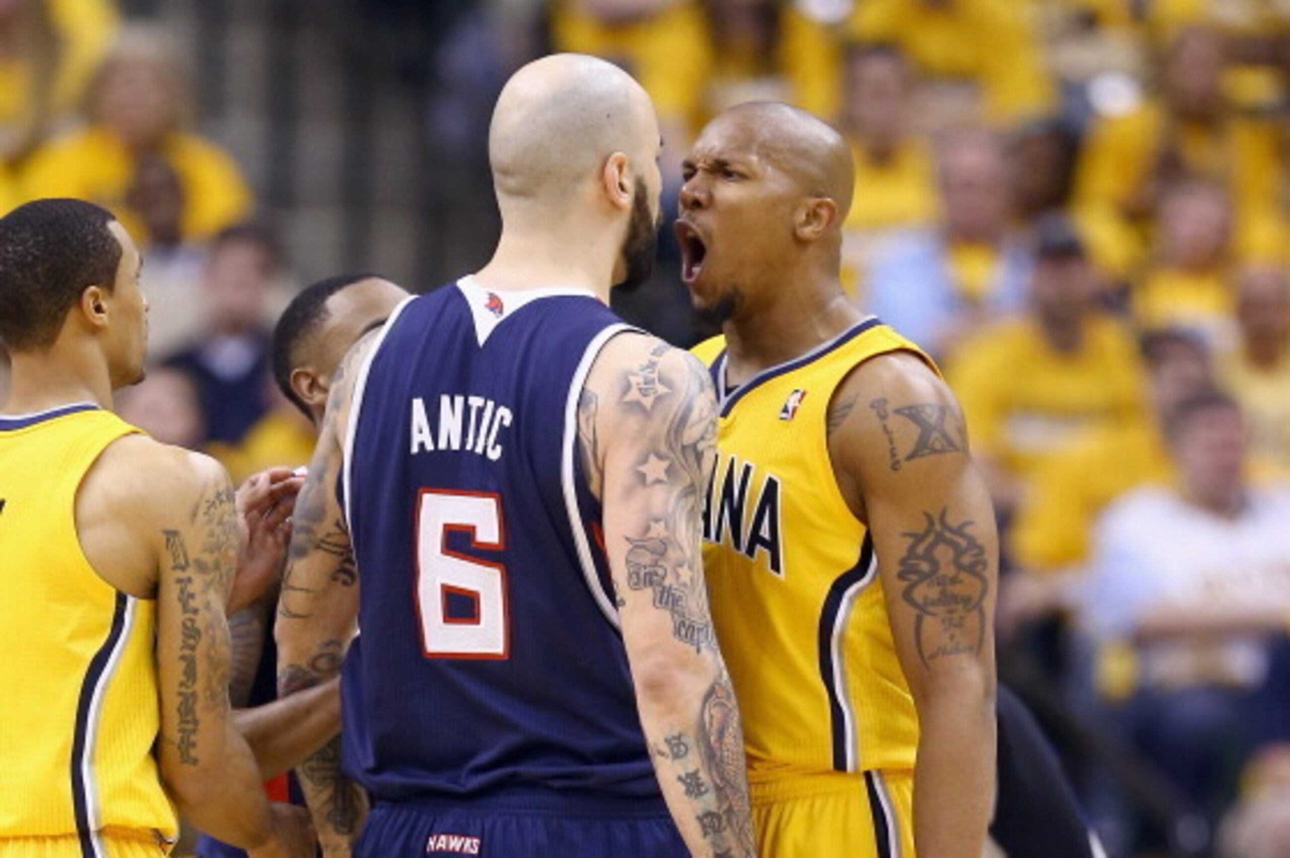 INDIANAPOLIS, IN - APRIL 19:  Pero Antic #6 of the Atllanta Hawks and David West #21 of the Indiana Pacers square off in Game 1 of the Eastern Conference Quarterfinals during the 2014 NBA Playoffs at Bankers Life Fieldhouse on April 19, 2014 in Indianapol
