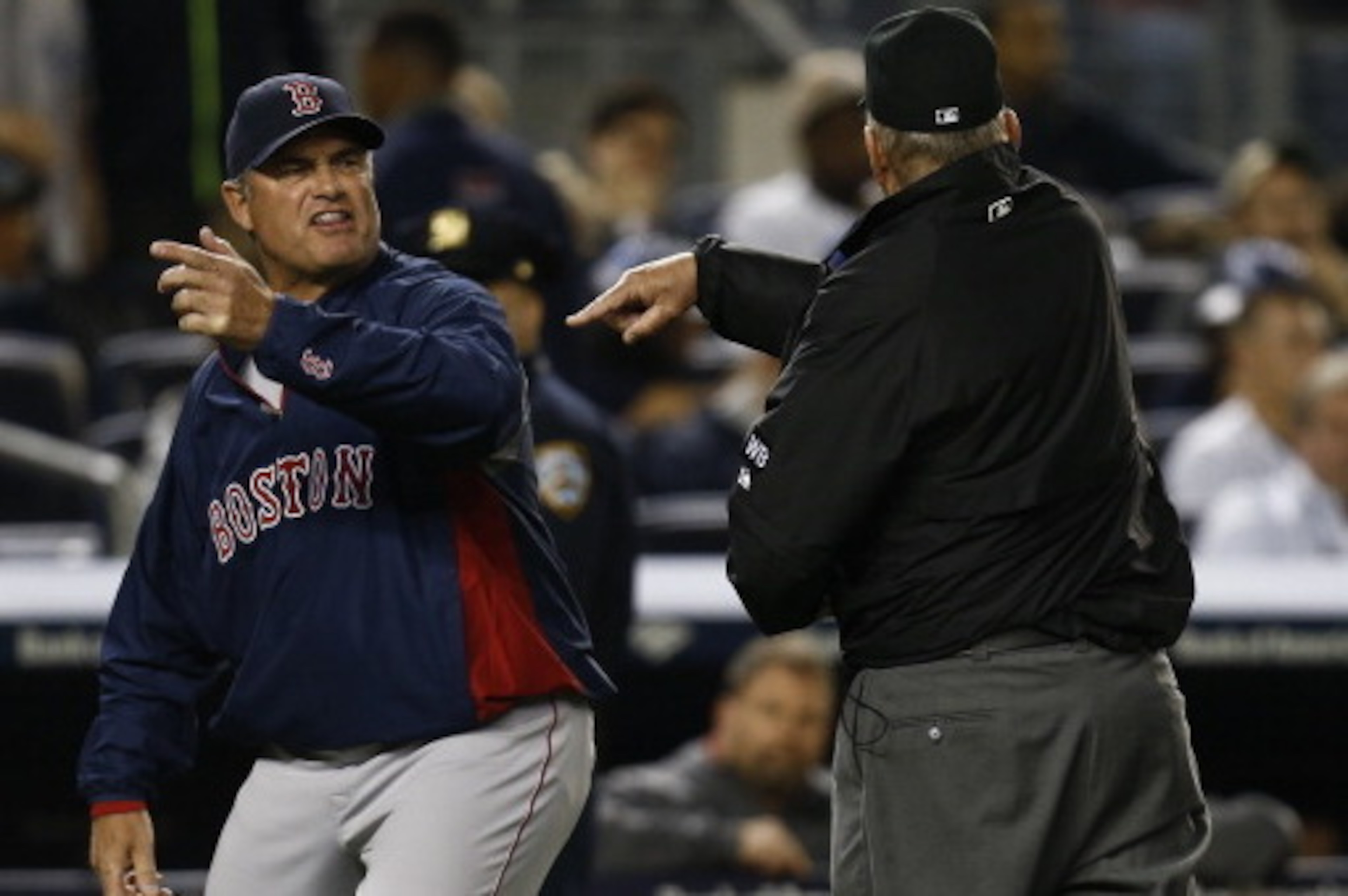 NEW YORK, NY - APRIL 13:  John Farrell #53 of the Boston Red Sox is ejected by umpire Bob Davidson #61after arguing a call settled by instant replay during a game against the New York Yankees at Yankee Stadium on April 13, 2014 in the Bronx Borough of New