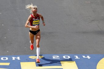 BOSTON, MA - APRIL 21:  Shalane Flanagan crosses the finish line of the 118th Boston Marathon on April 21, 2014 in Boston, Massachusetts.  (Photo by Jim Rogash/Getty Images)
