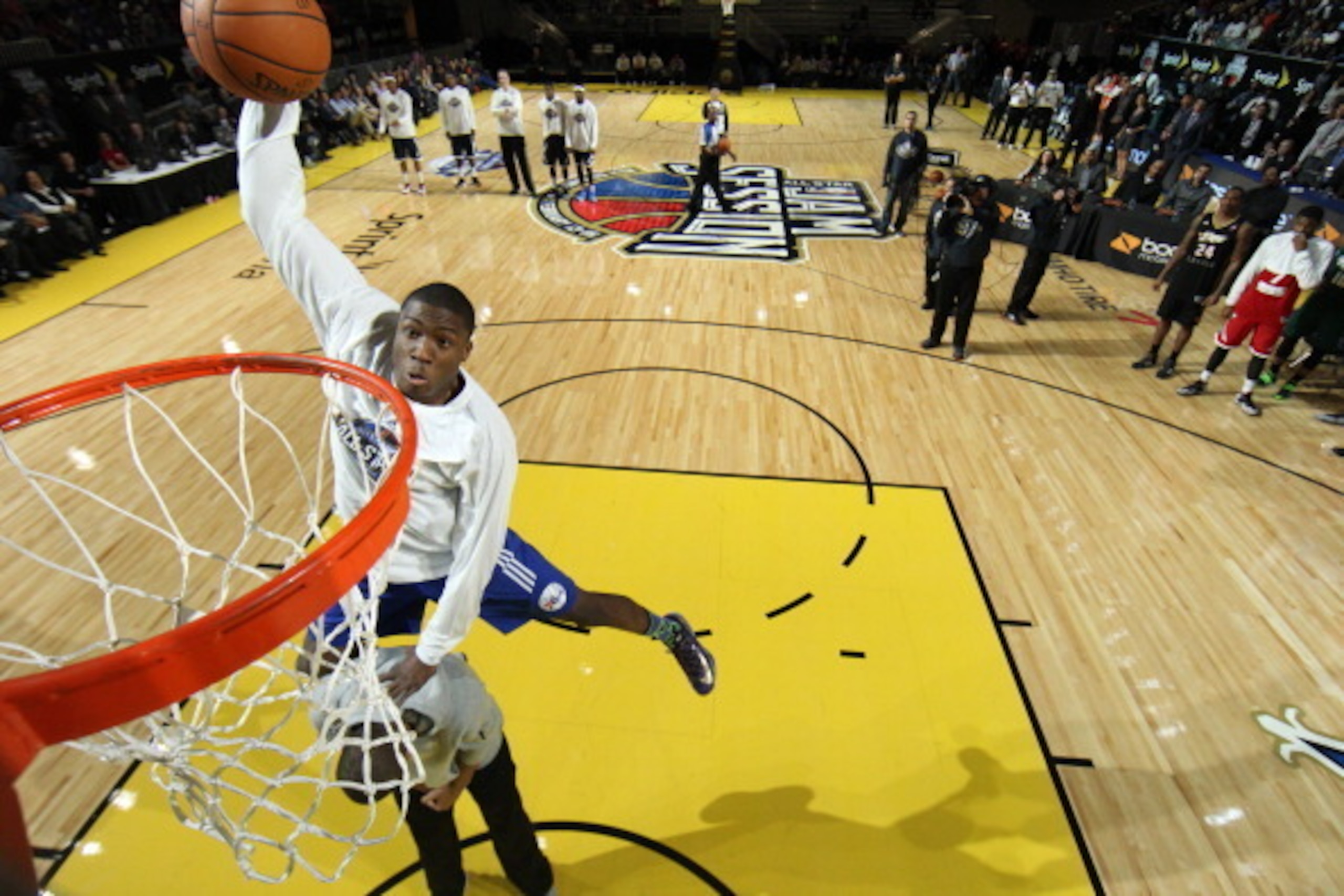 NEW ORLEANS, LA - FEBRUARY 15:  Thanasis Antetokounmpo #19 of the Deleware 87ers dunks over his brother, Giannis Antetokounmpo of the Milwaukee Bucks during the Slam Dunk Contest as part of the NBA Dream Factory presented by Boost Mobile 2014 at Sprint Ar