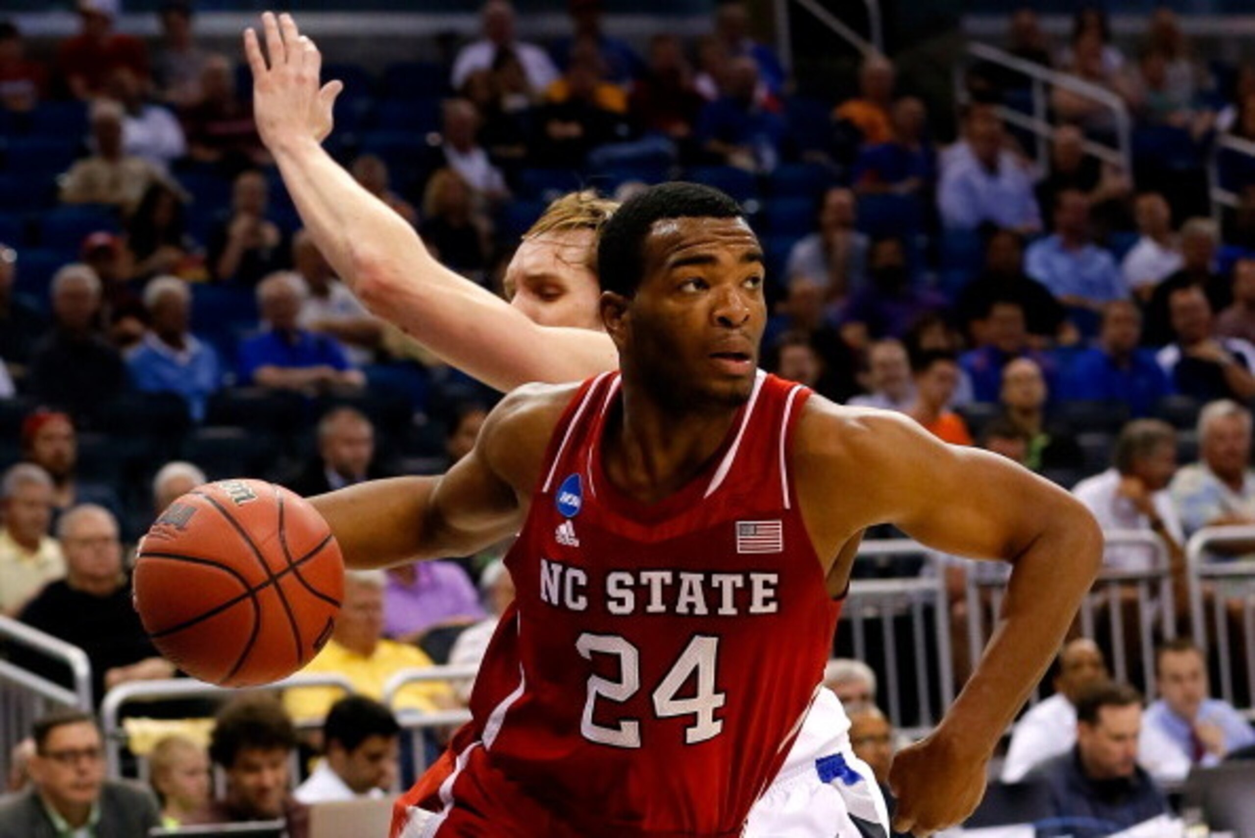 ORLANDO, FL - MARCH 20:  T.J. Warren #24 of the North Carolina State Wolfpack drives to the basket against Jake Barnett #30 of the Saint Louis Billikens during the second round of the 2014 NCAA Men's Basketball Tournament at Amway Center on March 20, 2014