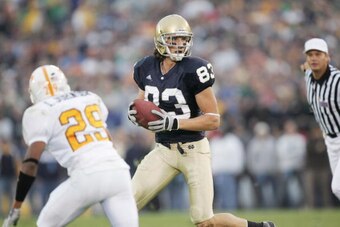 SOUTH BEND, IN - NOVEMBER 5:  Wide receiver Jeff Samardzija #83 of the Notre Dame Fighting Irish carries the ball against the Tennessee Volunteers on November 5, 2005 at Notre Dame Stadium in South Bend, Indiana. The Irish defeated the Vols 41-21.  (Photo