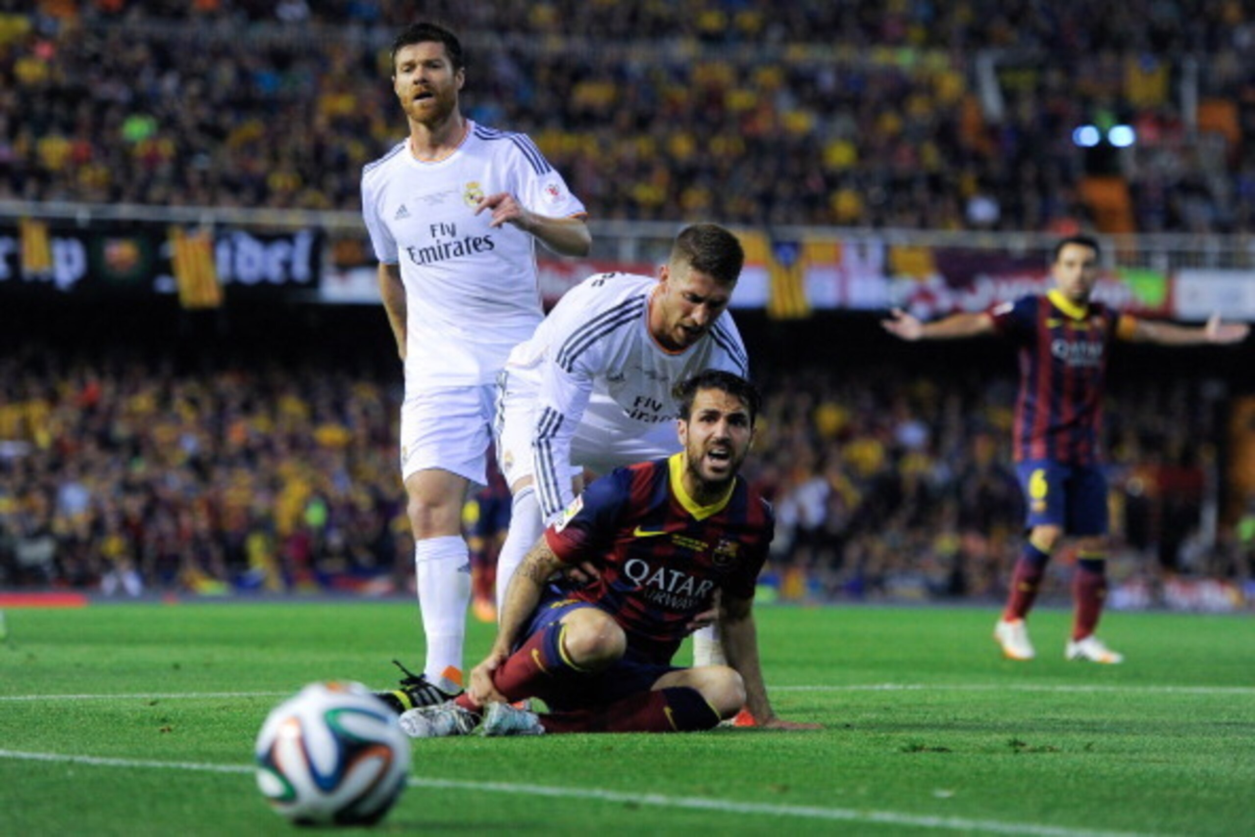 VALENCIA, SPAIN - APRIL 16:  Sergio Ramos of Real Madrid CF argues with Cesc Fabregas of FC Barcelona during the Copa del Rey Final between Real Madrid and FC Barcelona at Estadio Mestalla on April 16, 2014 in Valencia, Spain.  (Photo by David Ramos/Getty