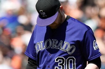 SAN FRANCISCO, CA - APRIL 12:  Starting pitcher Brett Anderson #30 of the Colorado Rockies leaves the game with a left index finger contusion in the bottom of the fourth inning against the San Francisco Giants at AT&T Park on April 12, 2014 in San Francis