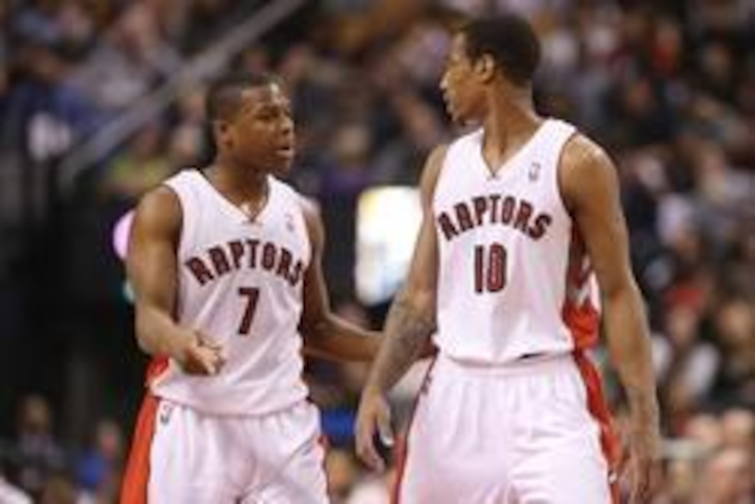 Jan 25, 2014; Toronto, Ontario, CAN; Toronto Raptors point guard Kyle Lowry (7) talks to guard DeMar DeRozan (10) against the Los Angeles Clippers at Air Canada Centre. The Clippers beat the Raptors 126-118. Mandatory Credit: Tom Szczerbowski-USA TODAY Sp