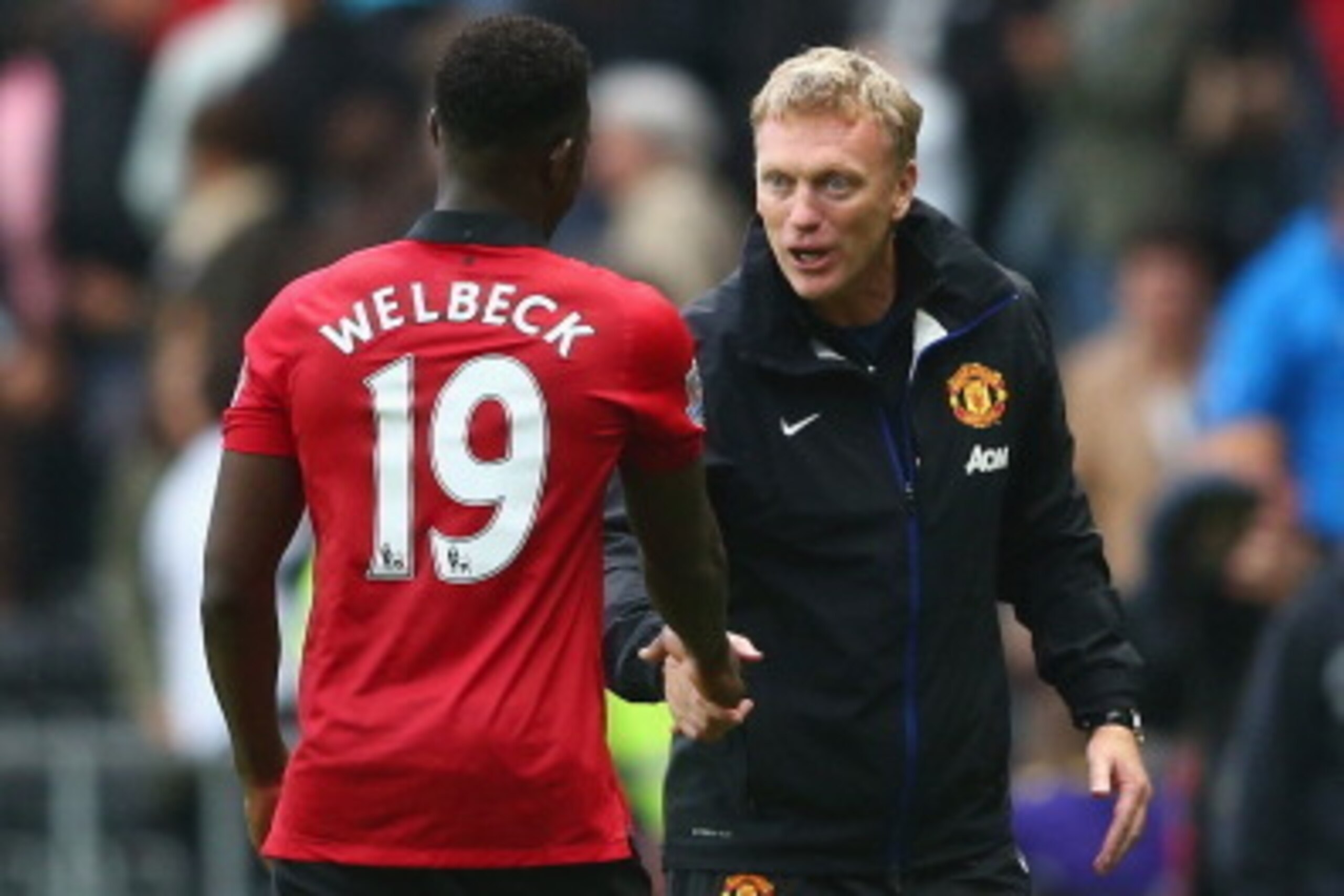 SWANSEA, WALES - AUGUST 17:  David Moyes (R) the manager of Manchester United shakes hands with Danny Welbeck (L) after the final whistle during the Barclays Premier League match between Swansea City and Manchester United at the Liberty Stadium on August 