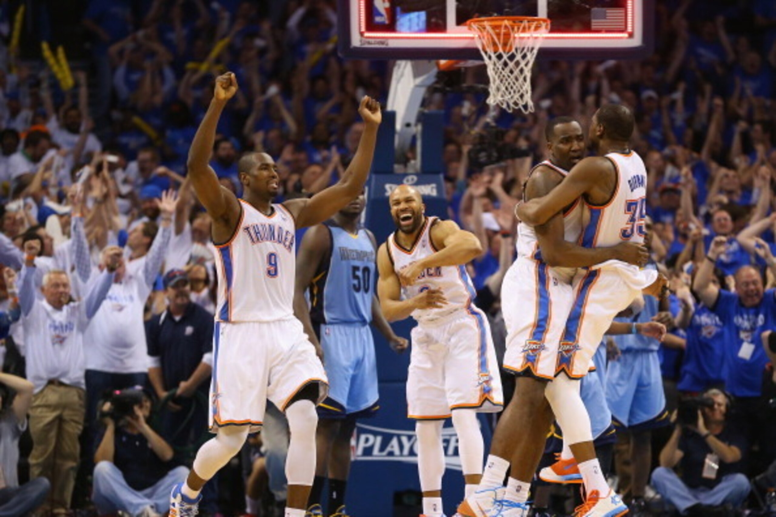 OKLAHOMA CITY, OK - APRIL 21:  Kendrick Perkins #5 of the Oklahoma City Thunder celebrates after making a shot to tie the Memphis Grizzlies in regulation with Derek Fisher #6 and Kevin Durant #35  in Game Two of the Western Conference Quarterfinals during