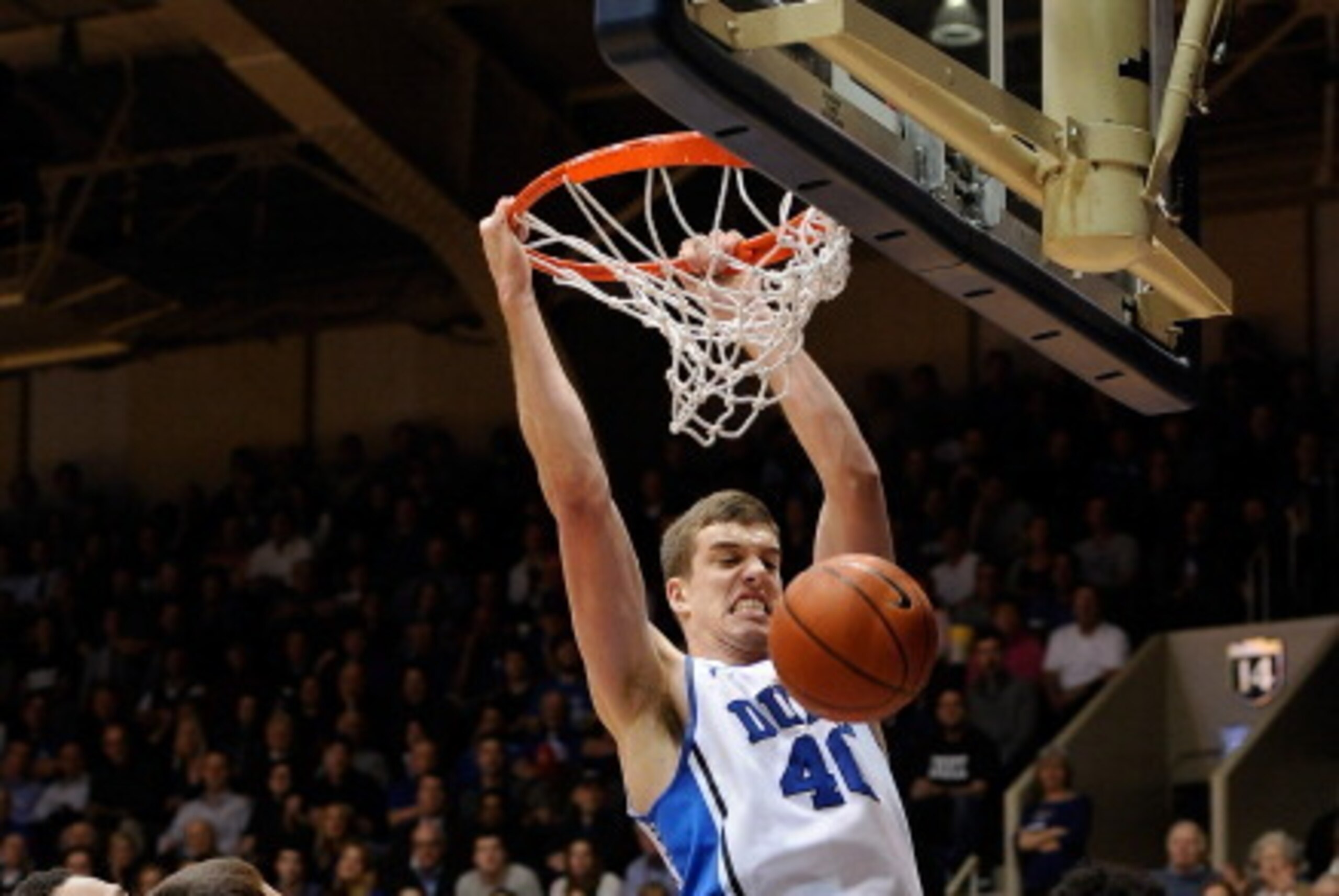 DURHAM, NC - FEBRUARY 25: Marshall Plumlee #40 of the Duke Blue Devils dunks a rebound over Trevor Thompson #32, Christian Beyer #22 and Marshall Wood #33 of the Virginia Tech Hokies during a game at Cameron Indoor Stadium on February 25, 2014 in Durham, DURHAM, NC - FEBRUARY 25: Marshall Plumlee #40 of the Duke Blue Devils dunks a rebound over Trevor Thompson #32, Christian Beyer #22 and Marshall Wood #33 of the Virginia Tech Hokies during a game at Cameron Indoor Stadium on February 25, 2014 in Durham,