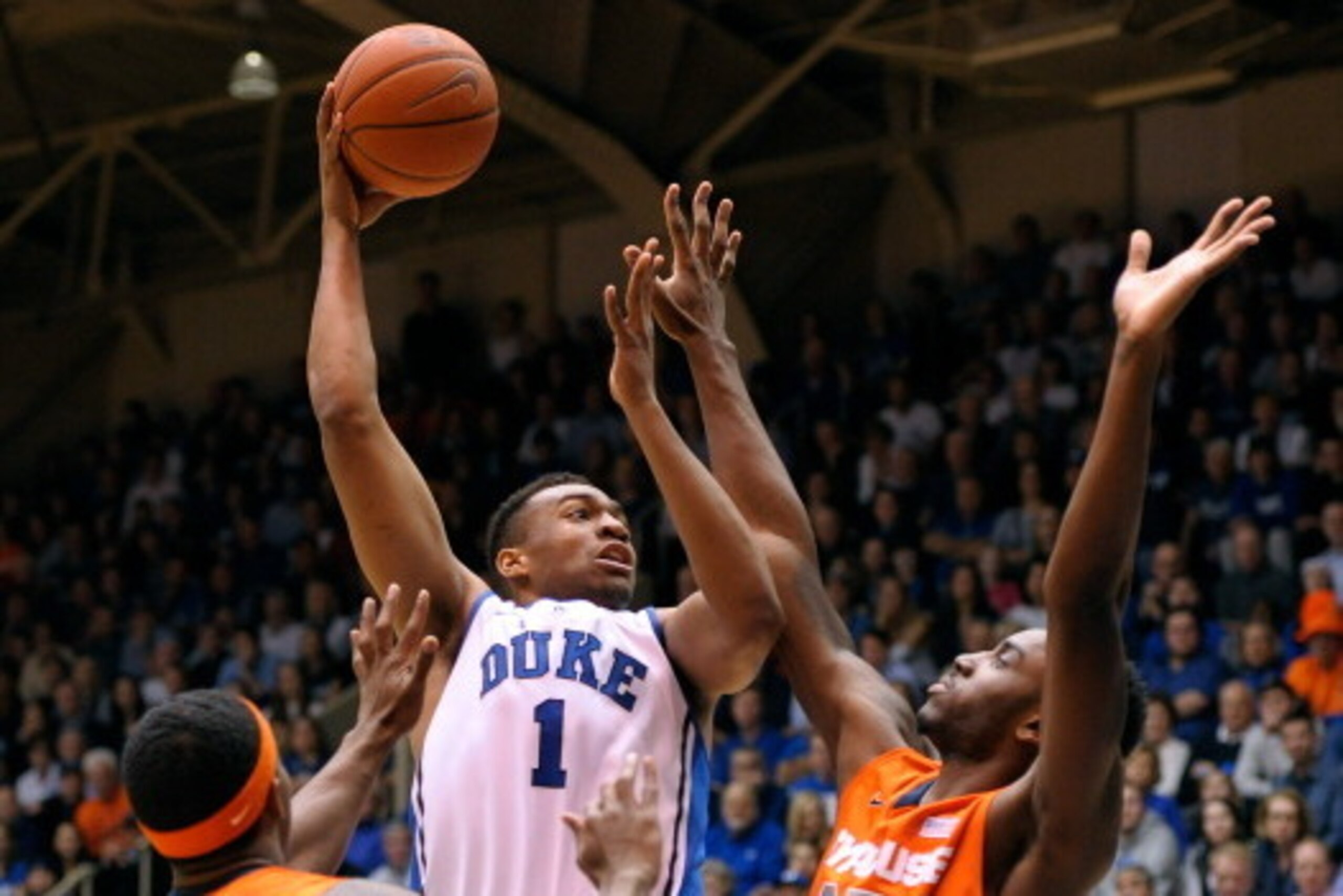 DURHAM, NC - FEBRUARY 22: Jabari Parker #1 of the Duke Blue Devils shoots over C.J. Fair #5 and Rakeem Christmas #25 of the Syracuse Orange during their game at Cameron Indoor Stadium on February 22, 2014 in Durham, North Carolina. (Photo by Grant Halve DURHAM, NC - FEBRUARY 22: Jabari Parker #1 of the Duke Blue Devils shoots over C.J. Fair #5 and Rakeem Christmas #25 of the Syracuse Orange during their game at Cameron Indoor Stadium on February 22, 2014 in Durham, North Carolina. (Photo by Grant Halve