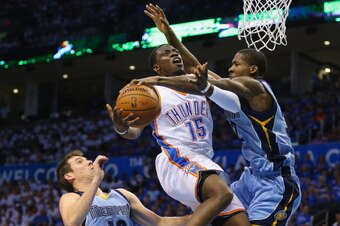 OKLAHOMA CITY, OK - APRIL 21:  Reggie Jackson #15 of the Oklahoma City Thunder is blocked by Ed Davis #32 of the Memphis Grizzlies in Game Two of the Western Conference Quarterfinals during the 2014 NBA Playoffs at Chesapeake Energy Arena on April 21, 201
