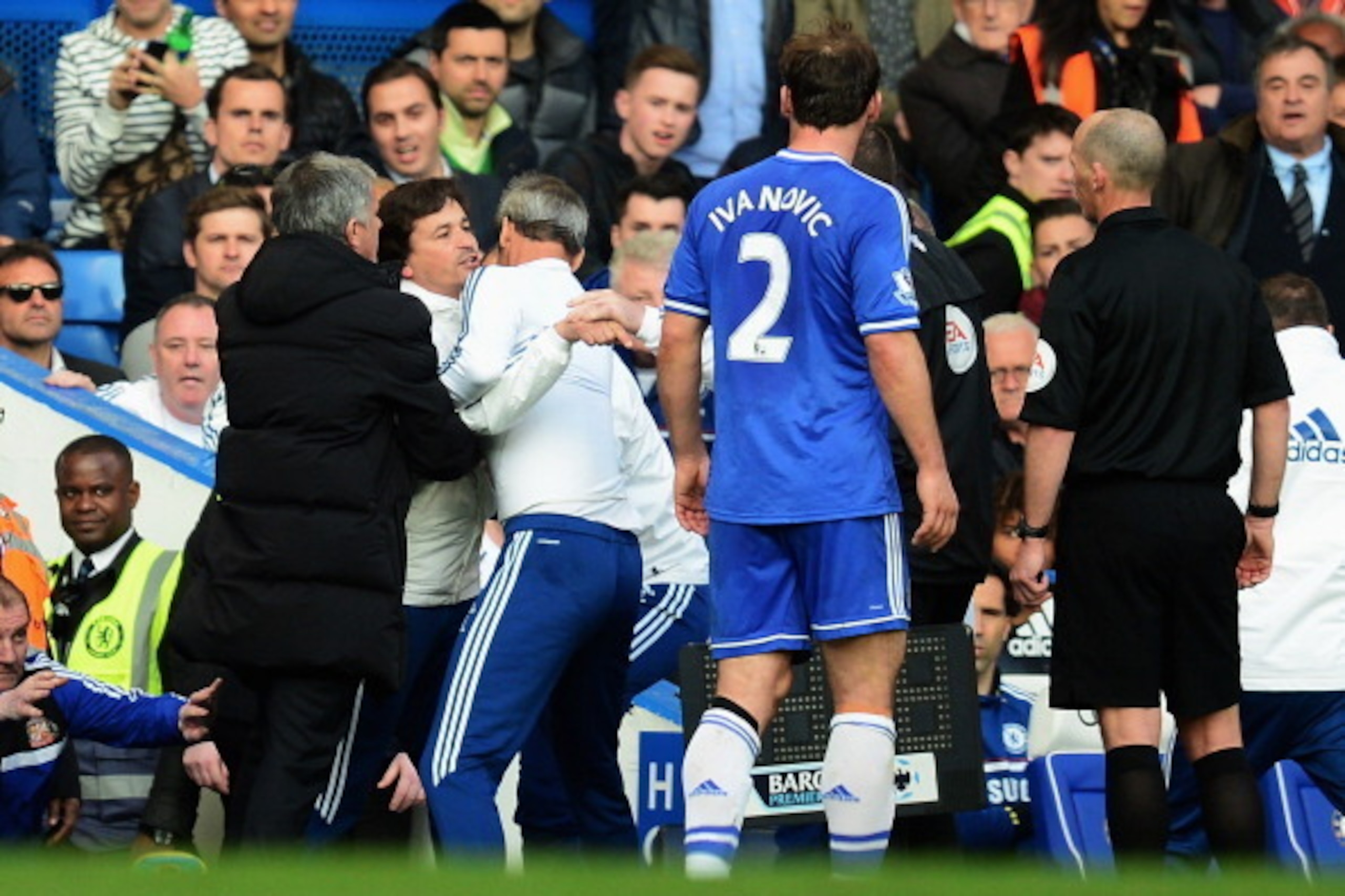 LONDON, ENGLAND - APRIL 19:  Chelsea coach Rui Faria is held back by Jose Mourinho and other members of coaching staff as he confronts match referee Mike Dean during the Barclays Premier League match between Chelsea and Sunderland at Stamford Bridge on Ap