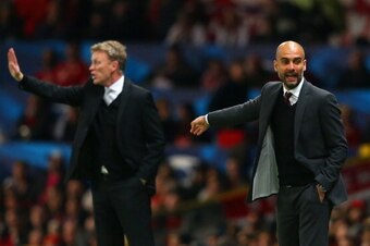 MANCHESTER, ENGLAND - APRIL 01:  David Moyes manager of Manchester United and Pep Guardiola head coach of Bayern Muenchen give instructions during the UEFA Champions League Quarter Final first leg match between Manchester United and FC Bayern Muenchen at 