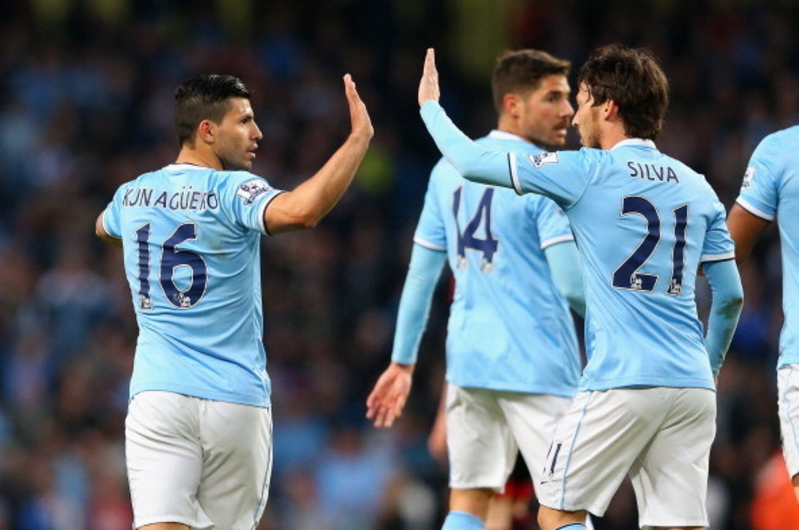 MANCHESTER, ENGLAND - APRIL 21:  Sergio Aguero of Manchester City celebrates with David Silva after scoring the second goal during the Barclays Premier League match between Manchester City and West Bromwich Albion at Etihad Stadium on April 21, 2014 in Ma