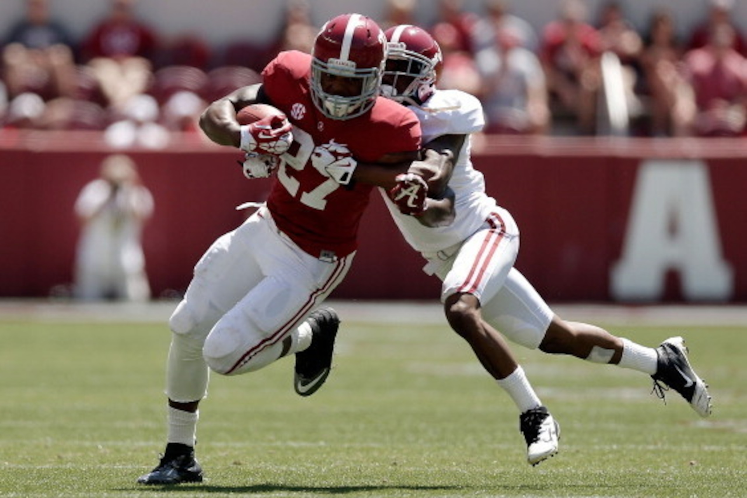 TUSCALOOSA, AL - APRIL 19:  Derrick Henry #27 of the Crimson team is brought down by Bradley Sylve #3 of the White team during the University of Alabama A-Day spring game at Bryant-Denny Stadium on April 19, 2014 in Tuscaloosa, Alabama.  (Photo by Stacy R
