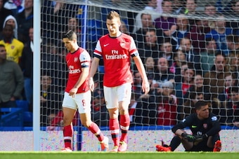 LONDON, ENGLAND - MARCH 22:  A dejected Mikel Arteta and Laurent Koscielny of Arsenal after conceding a fourth goal during the Barclays Premier League match between Chelsea and Arsenal at Stamford Bridge on March 22, 2014 in London, England.  (Photo by Sh