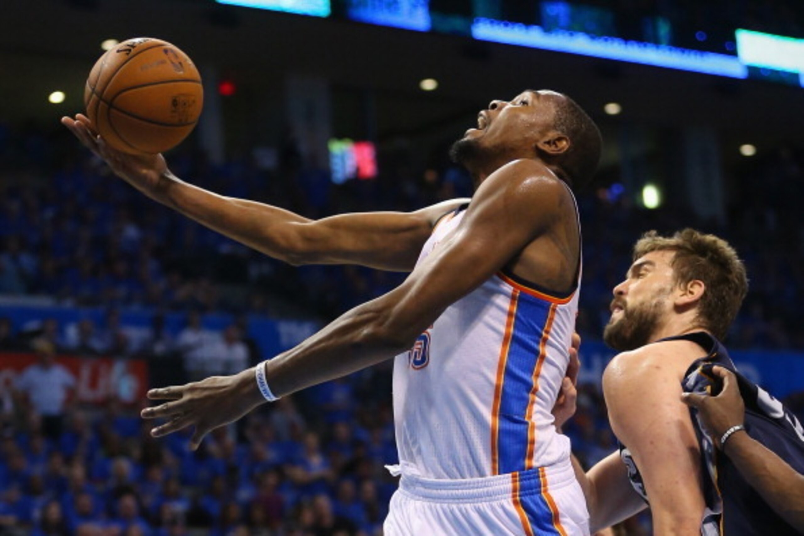 OKLAHOMA CITY, OK - APRIL 19:  Kevin Durant #35 of the Oklahoma City Thunder takes a shot against Marc Gasol #33 of the Memphis Grizzlies in Game One of the Western Conference Quarterfinals during the 2014 NBA Playoffs at Chesapeake Energy Arena on April 
