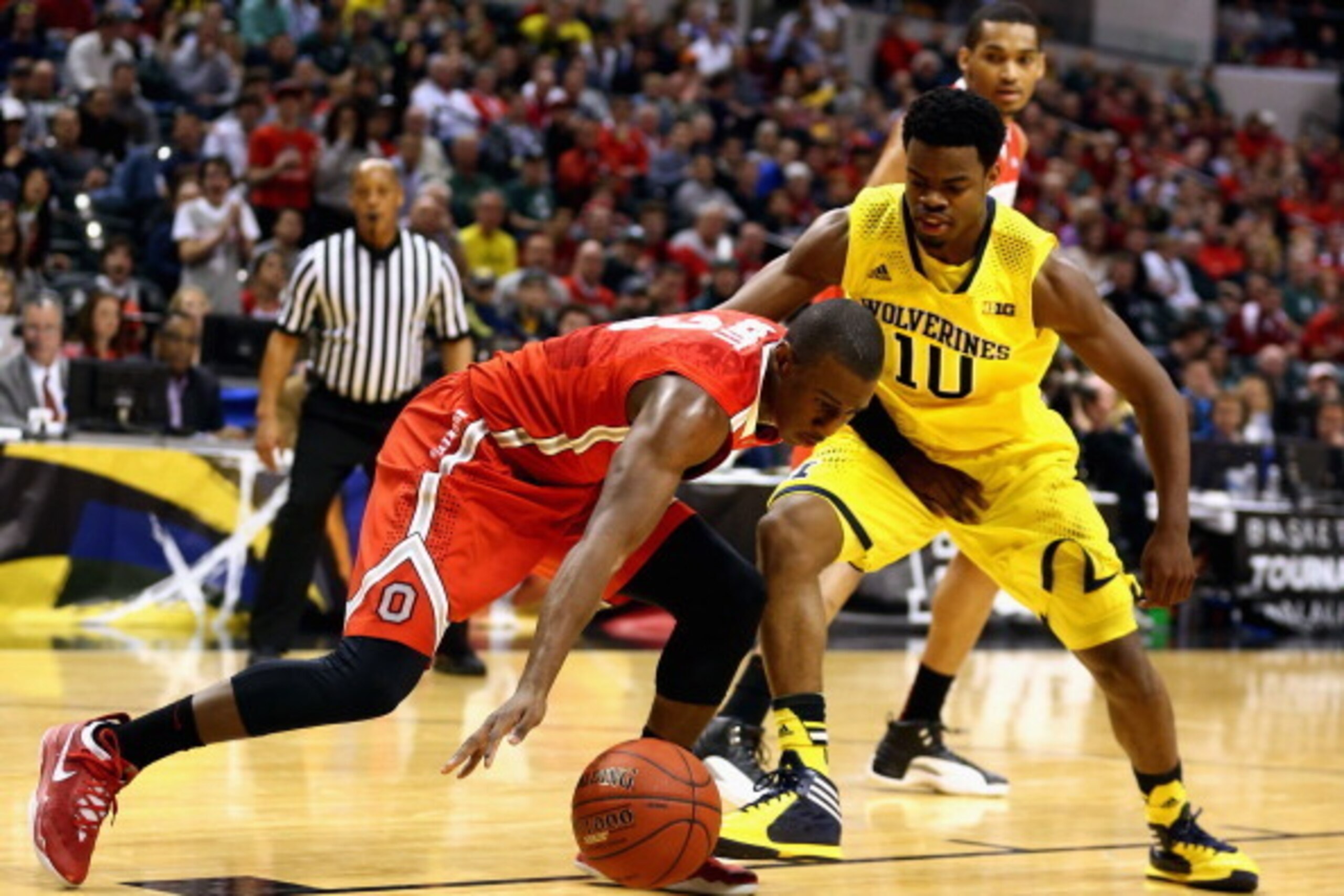INDIANAPOLIS, IN - MARCH 15:  Shannon Scott #3 of the Ohio State Buckeyes tries to keep controls of the ball against Derrick Walton Jr. #10 of the Michigan Wolverines during the first half of the Big Ten Basketball Tournament Semifinal game at Bankers Lif