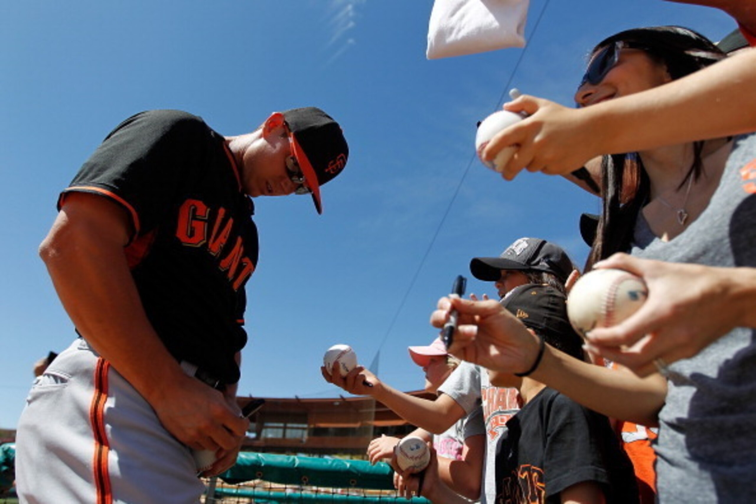 GLENDALE, AZ - MARCH 22: Gary Brown #56 of the San Francisco Giants signs autographs before a game against the Chicago White Sox at Camelback Ranch on March 22, 2014 in Glendale, Arizona. The San Francisco Giants defeated the Chicago White Sox 8-5. (Photo