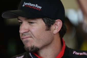 DAYTONA BEACH, FL - FEBRUARY 23:  Martin Truex Jr., driver of the #78 Furniture Row Chevrolet, reacts in the garage after blowing his engine during the NASCAR Sprint Cup Series Daytona 500 at Daytona International Speedway on February 23, 2014 in Daytona