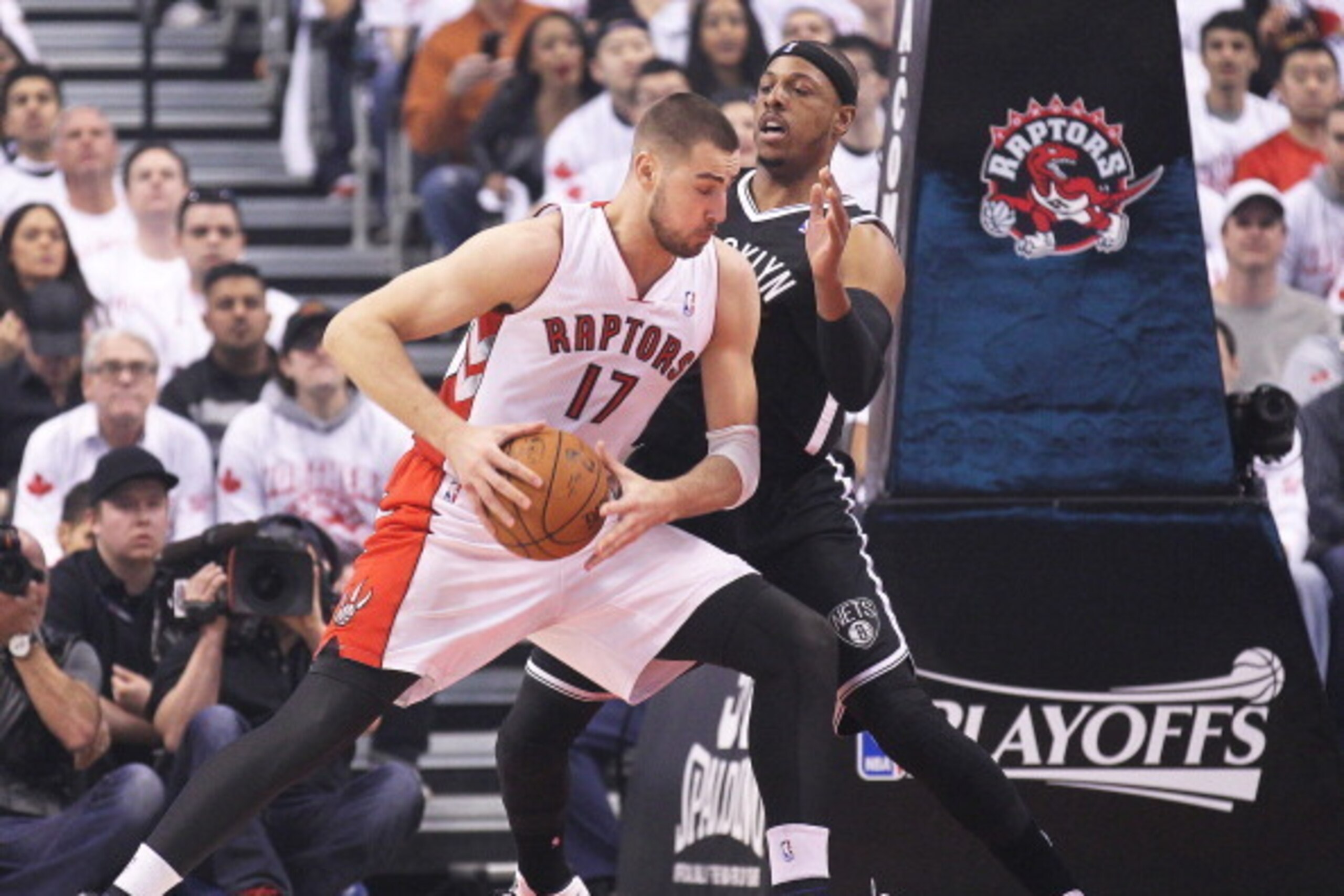 TORONTO, ON - APRIL 19:  Paul Pierce #34 of the Brooklyn Nets defends against Jonas Valanciunas #17 of the Toronto Raptors in Game One of the NBA Eastern Conference play-off at the Air Canada Centre on April 19, 2014 in Toronto, Ontario, Canada. The Nets 