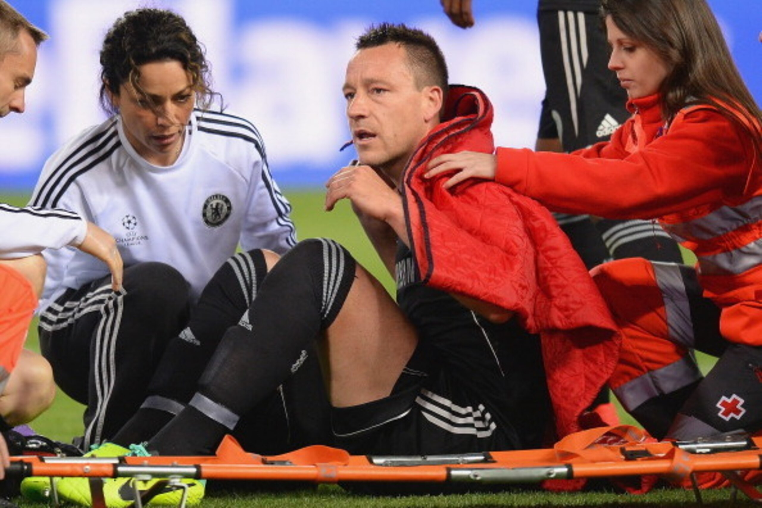MADRID, SPAIN - APRIL 22:  An injured John Terry of Chelsea receives treatment during the UEFA Champions League Semi Final first leg match between Club Atletico de Madrid and Chelsea at Vicente Calderon Stadium on April 22, 2014 in Madrid, Spain.  (Photo 