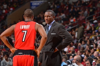 PHILADELPHIA, PA - NOVEMBER 20:  Dwane Casey of the Toronto Raptors speaks with Kyle Lowry #7 during the game against the Philadelphia 76ers at the Wells Fargo Center on November 20, 2013 in Philadelphia, Pennsylvania. NOTE TO USER: User expressly acknowl