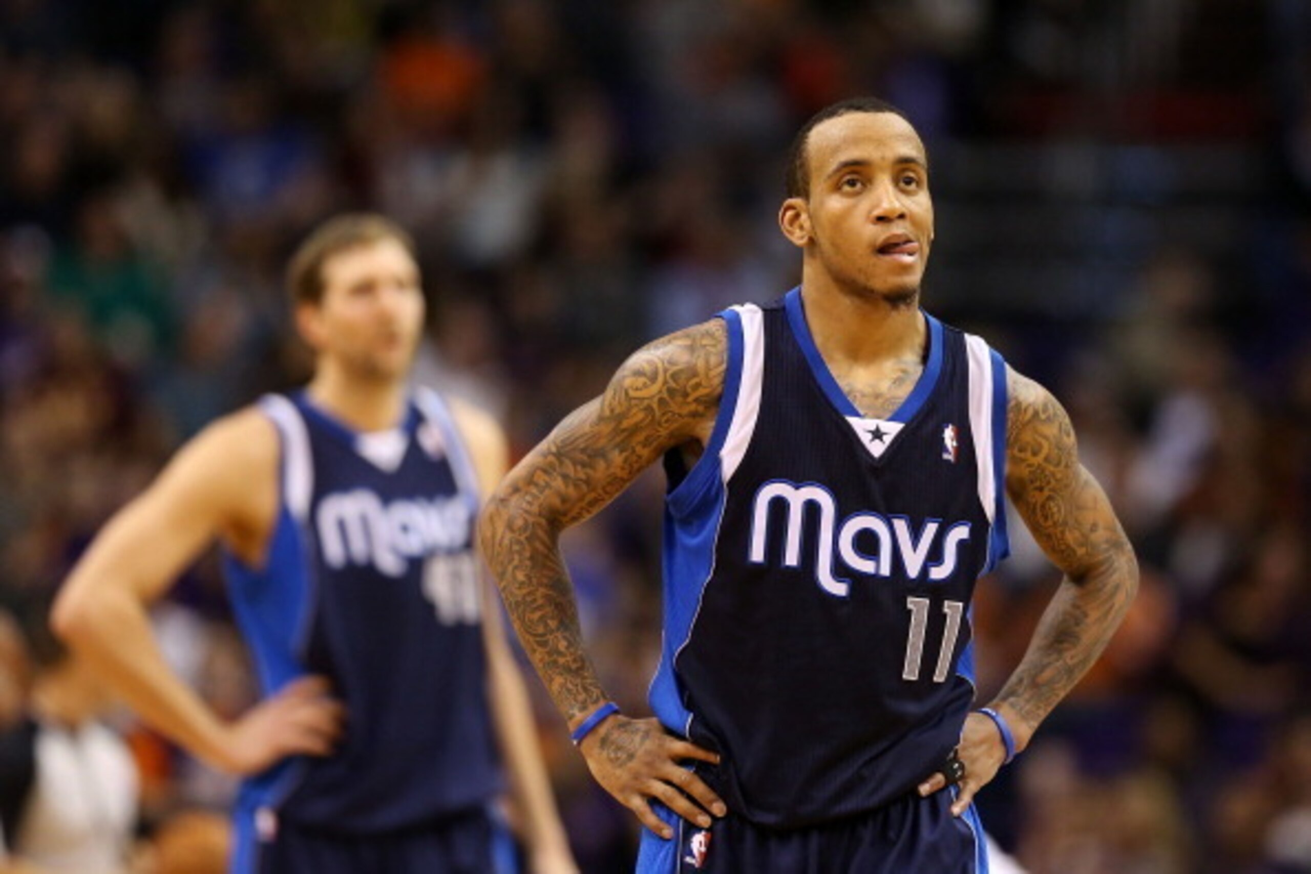 PHOENIX, AZ - DECEMBER 21: Monta Ellis #11 (R) and Dirk Nowitzki #41 of the Dallas Mavericks react during the fourth quarter of the NBA game against the Phoenix Suns at US Airways Center on December 21, 2013 in Phoenix, Arizona. The Suns defeated the Ma PHOENIX, AZ - DECEMBER 21: Monta Ellis #11 (R) and Dirk Nowitzki #41 of the Dallas Mavericks react during the fourth quarter of the NBA game against the Phoenix Suns at US Airways Center on December 21, 2013 in Phoenix, Arizona. The Suns defeated the Ma