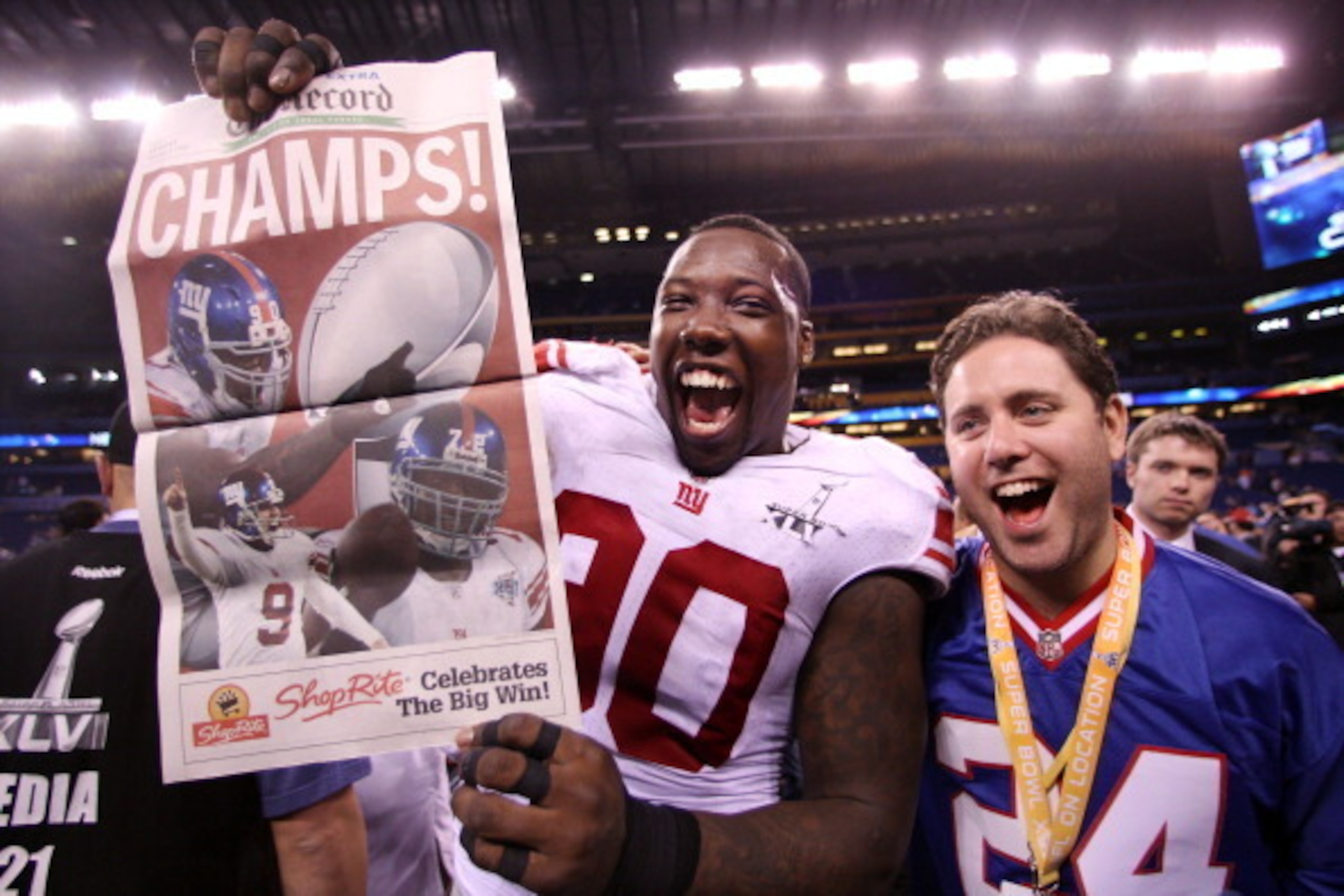 INDIANAPOLIS, IN - FEBRUARY 05:  Jason Pierre-Paul #90 of the New York Giants celebrates after the Giants defeated the Patriots by a score of 21-17 in Super Bowl XLVI at Lucas Oil Stadium on February 5, 2012 in Indianapolis, Indiana.  (Photo by Elsa/Getty