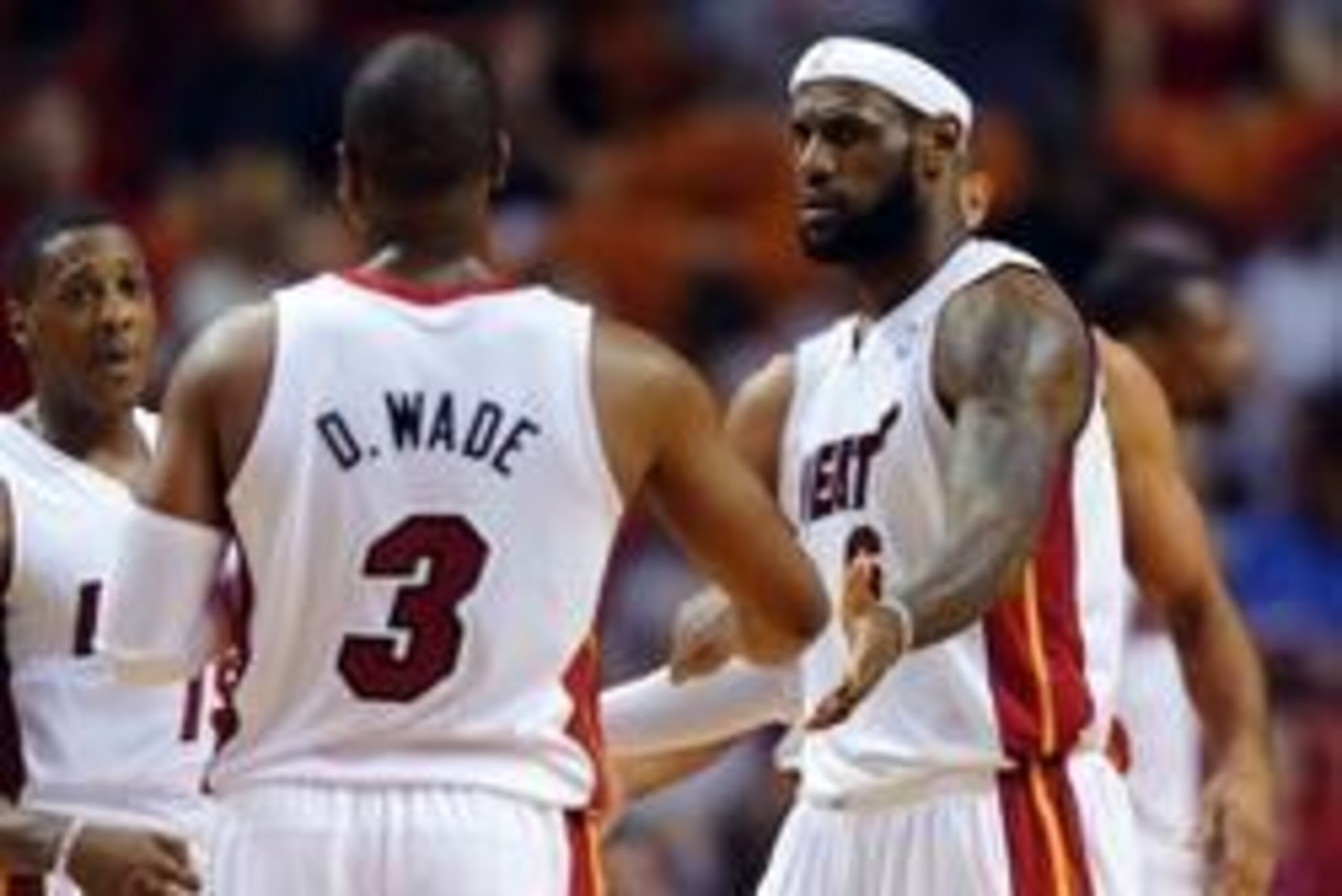Mar 12, 2014; Miami, FL, USA; Miami Heat forward LeBron James (right) greets teammate Dwyane Wade (left) during the first half against the Brooklyn Nets at American Airlines Arena. Mandatory Credit: Steve Mitchell-USA TODAY Sports Mar 12, 2014; Miami, FL, USA; Miami Heat forward LeBron James (right) greets teammate Dwyane Wade (left) during the first half against the Brooklyn Nets at American Airlines Arena. Mandatory Credit: Steve Mitchell-USA TODAY Sports