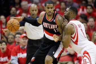 HOUSTON, TX - APRIL 20:  LaMarcus Aldridge #12 of the Portland Trail Blazers backs in on Terrence Jones #6 of the Houston Rockets in Game One of the Western Conference Quarterfinals during the 2014 NBA Playoffs at the Toyota Center on April 20, 2014 in Ho