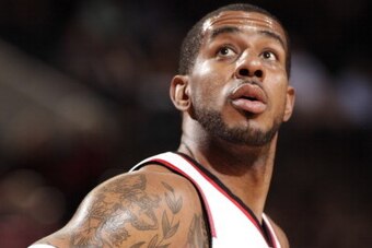 PORTLAND, OR - APRIL 13: LaMarcus Aldridge #12 of the Portland Trail Blazers stands on the court during a game against the Golden State Warriors on April 13, 2014 at the Moda Center Arena in Portland, Oregon. NOTE TO USER: User expressly acknowledges and 