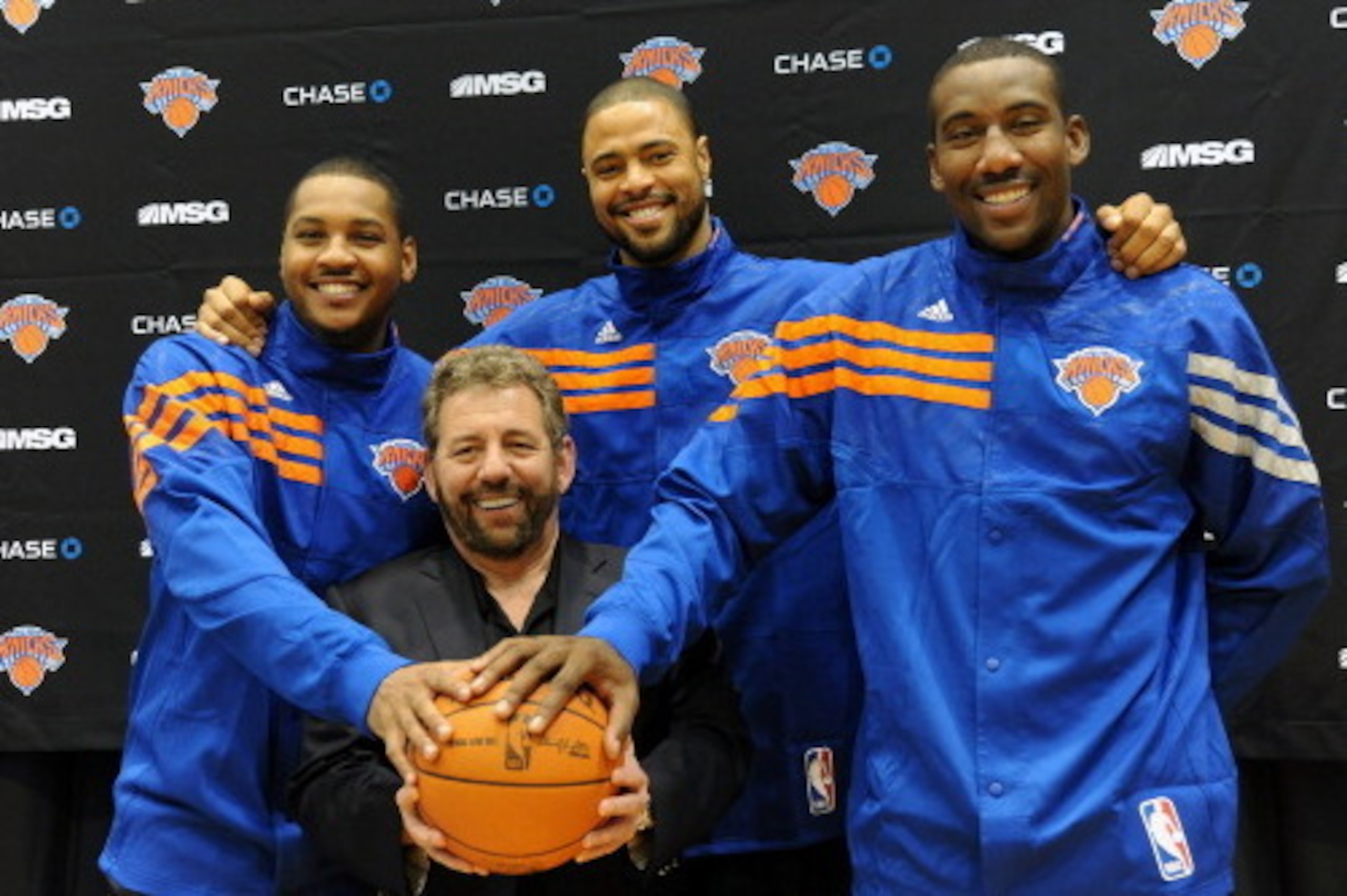 GREENBURGH, NY - DECEMBER 10: (L-R) Carmelo Anthony, Tyson Chandler, Amar'e Stoudemire of the New York Knicks and Executive Chairman of Madison Square Garden James Dolan during Chandler's introductory press conference on December 10, 2011 at The Knicks Tr