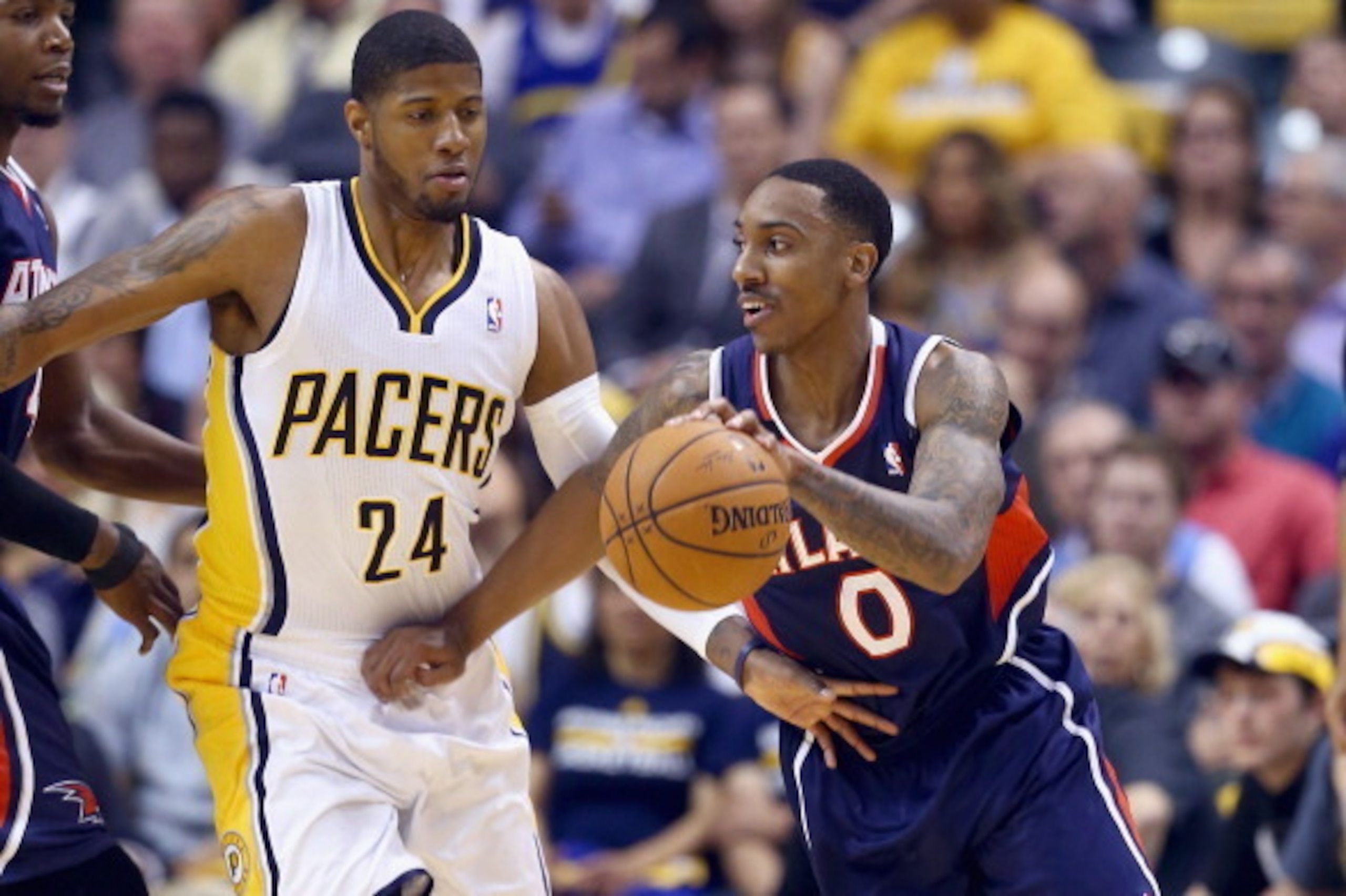 INDIANAPOLIS, IN - APRIL 22:  Paul George #24 of the Indiana Pacers defends Jeff Teague #0 of the Atlanta Hawks in Game 2 of the Eastern Conference Quarterfinals during the 2014 NBA Playoffs at Bankers Life Fieldhouse on April 22, 2014 in Indianapolis, In