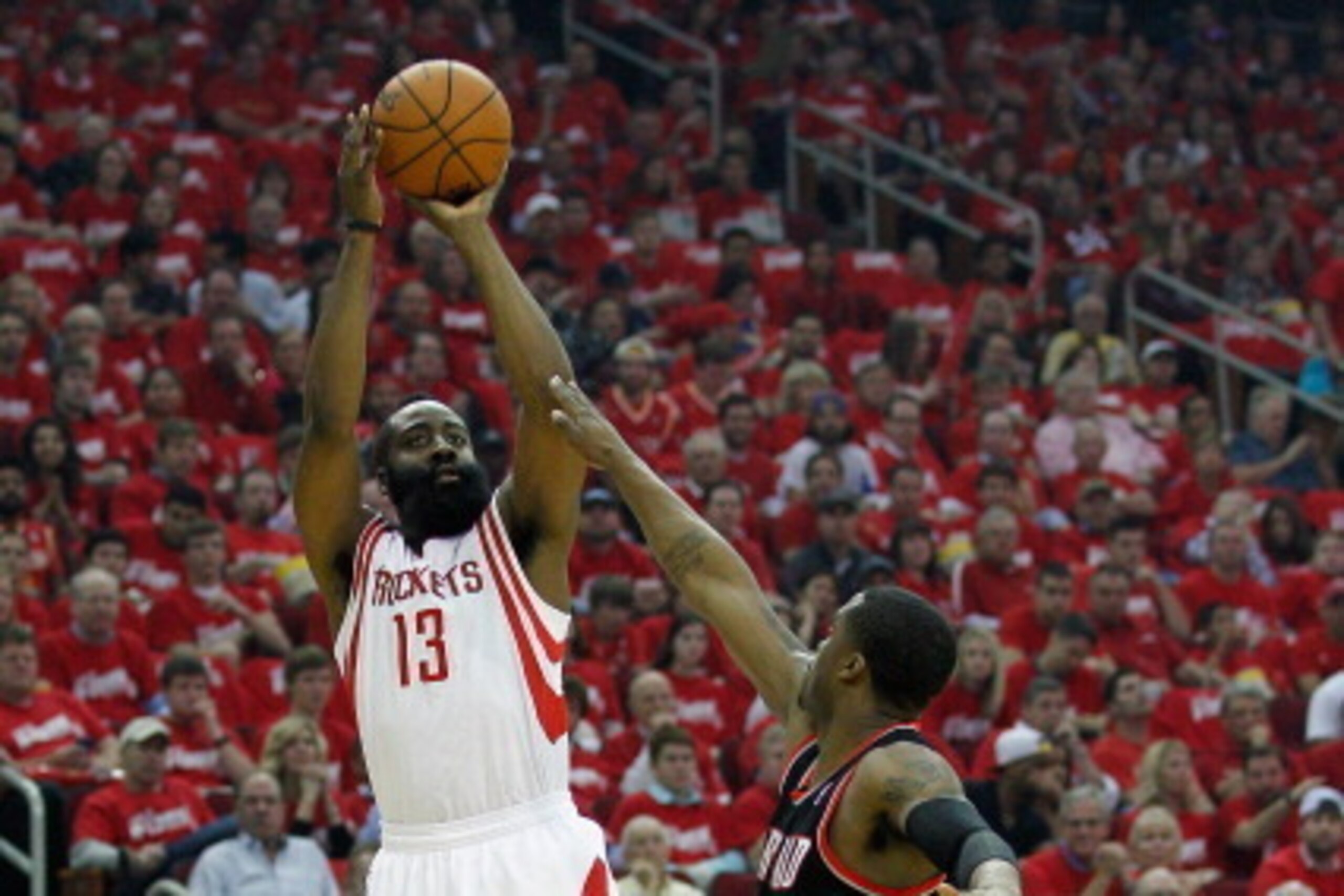 HOUSTON, TX - APRIL 20: James Harden #13 of the Houston Rockets shoots over Wesley Matthews #2 of the Portland Trail Blazers in Game One of the Western Conference Quarterfinals during the 2014 NBA Playoffs at the Toyota Center on April 20, 2014 in Houston