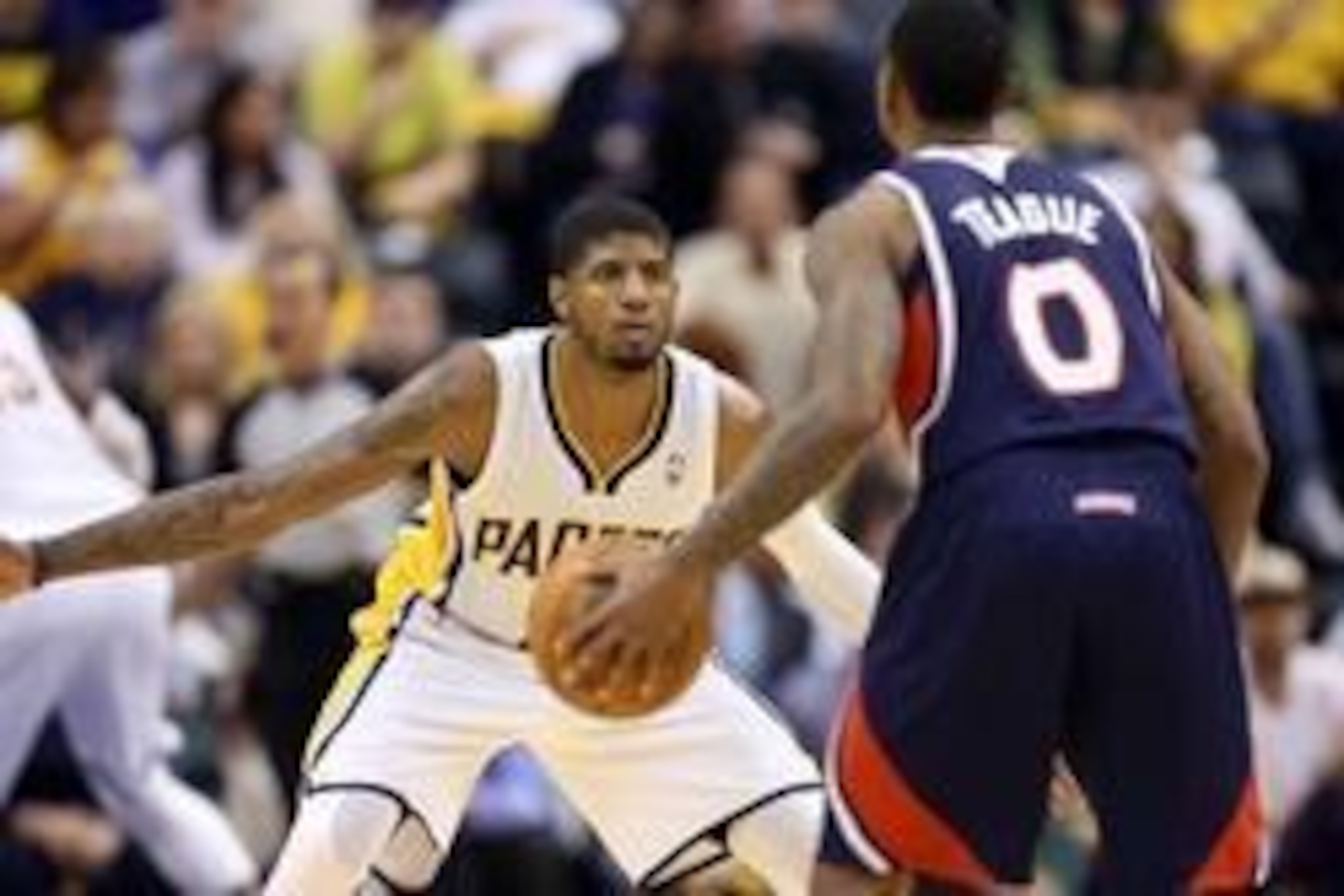 Apr 22, 2014; Indianapolis, IN, USA; Indiana Pacers forward Paul George (24) guards Atlanta Hawks guard Jeff Teague (0) in game two during the first round of the 2014 NBA Playoffs at Bankers Life Fieldhouse. Indiana defeats Atlanta 101-85. Mandatory Credi