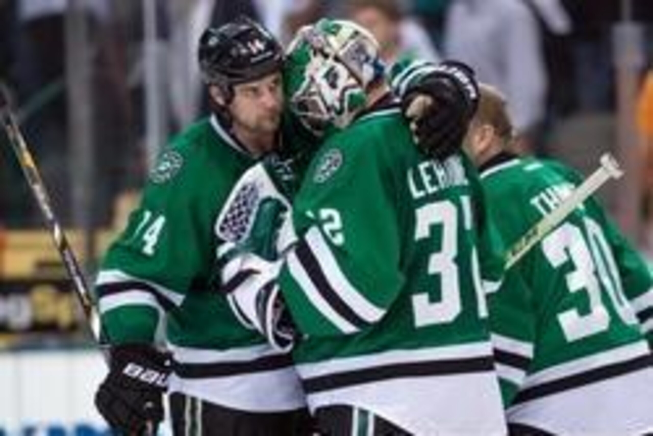 Apr 21, 2014; Dallas, TX, USA; Dallas Stars left wing Jamie Benn (14) and goalie Kari Lehtonen (32) celebrate the win over the Anaheim Ducks during the third period in game three of the first round of the 2014 Stanley Cup Playoffs at American Airlines Cen