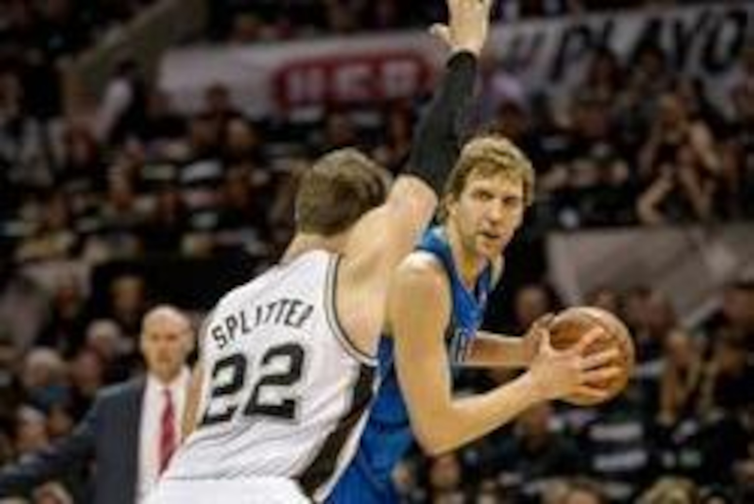 Apr 20, 2014; San Antonio, TX, USA; San Antonio Spurs center Tiago Splitter (22) guards Dallas Mavericks forward Dirk Nowitzki (41) during the first quarter in game one during the first round of the 2014 NBA Playoffs at AT&T Center. Mandatory Credit: Jero