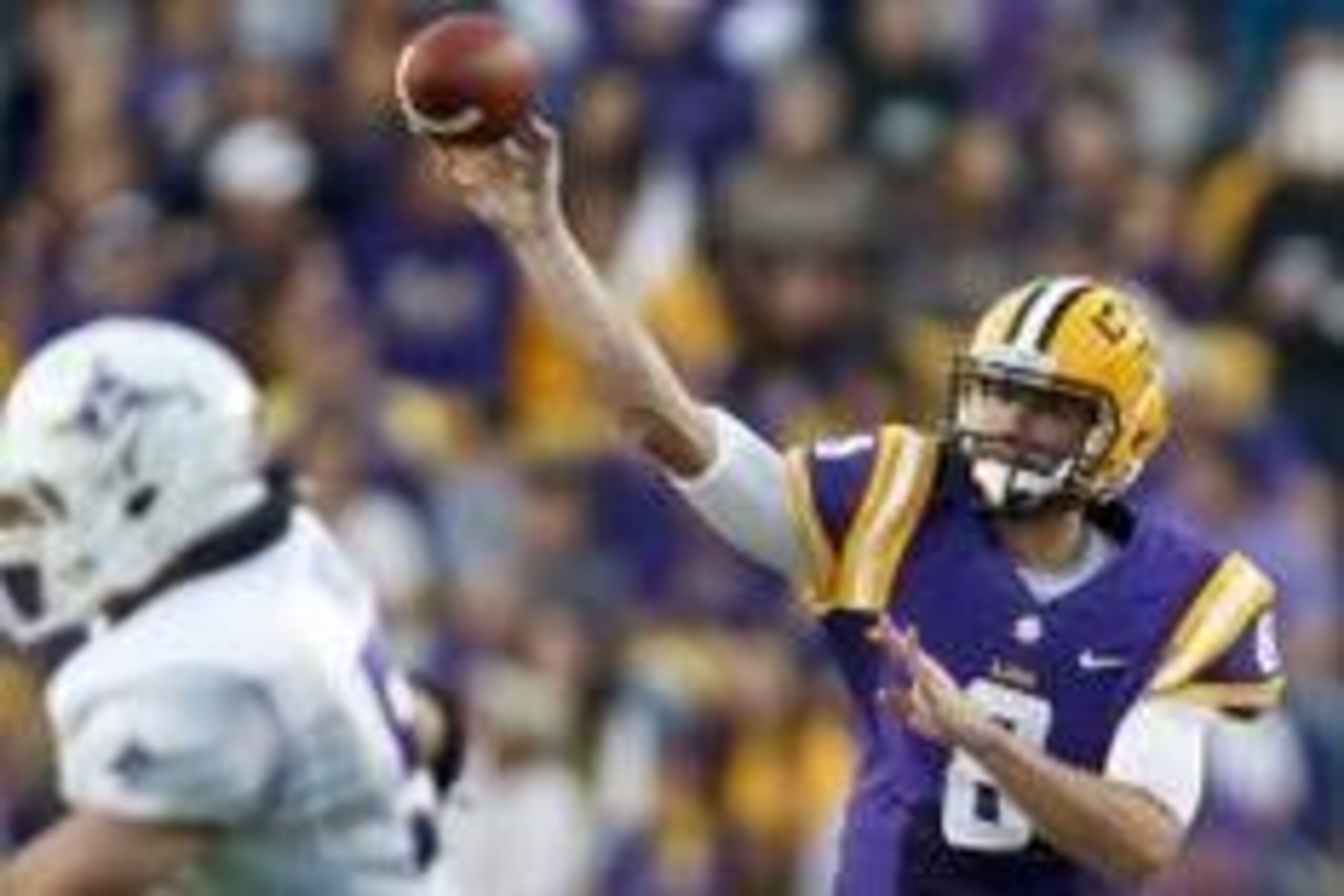 Oct 26, 2013; Baton Rouge, LA, USA; LSU Tigers quarterback Zach Mettenberger (8) throws against the Furman Paladins during the first quarter of a game at Tiger Stadium. Mandatory Credit: Derick E. Hingle-USA TODAY Sports