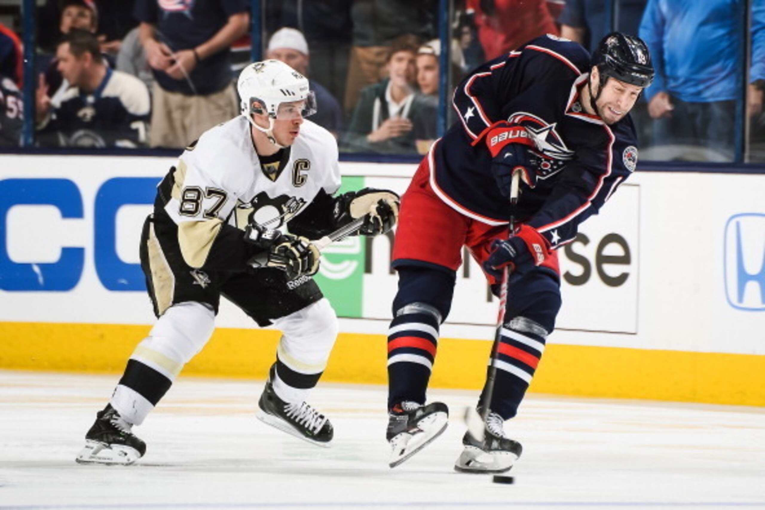 COLUMBUS, OH - APRIL 21:  R.J. Umberger #18 of the Columbus Blue Jackets skates with the puck as Sidney Crosby #87 of the Pittsburgh Penguins gives chase in Game Three of the First Round of the 2014 Stanley Cup Playoffs on April 21, 2014 at Nationwide Are