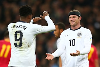 LONDON, ENGLAND - OCTOBER 11:  Wayne Rooney of England and Daniel Sturridge of England celebrate after Branko Boskovic of Montenegro (not pictured) scored an own goal to make it 2:0 during the FIFA 2014 World Cup Qualifying Group H match between England a