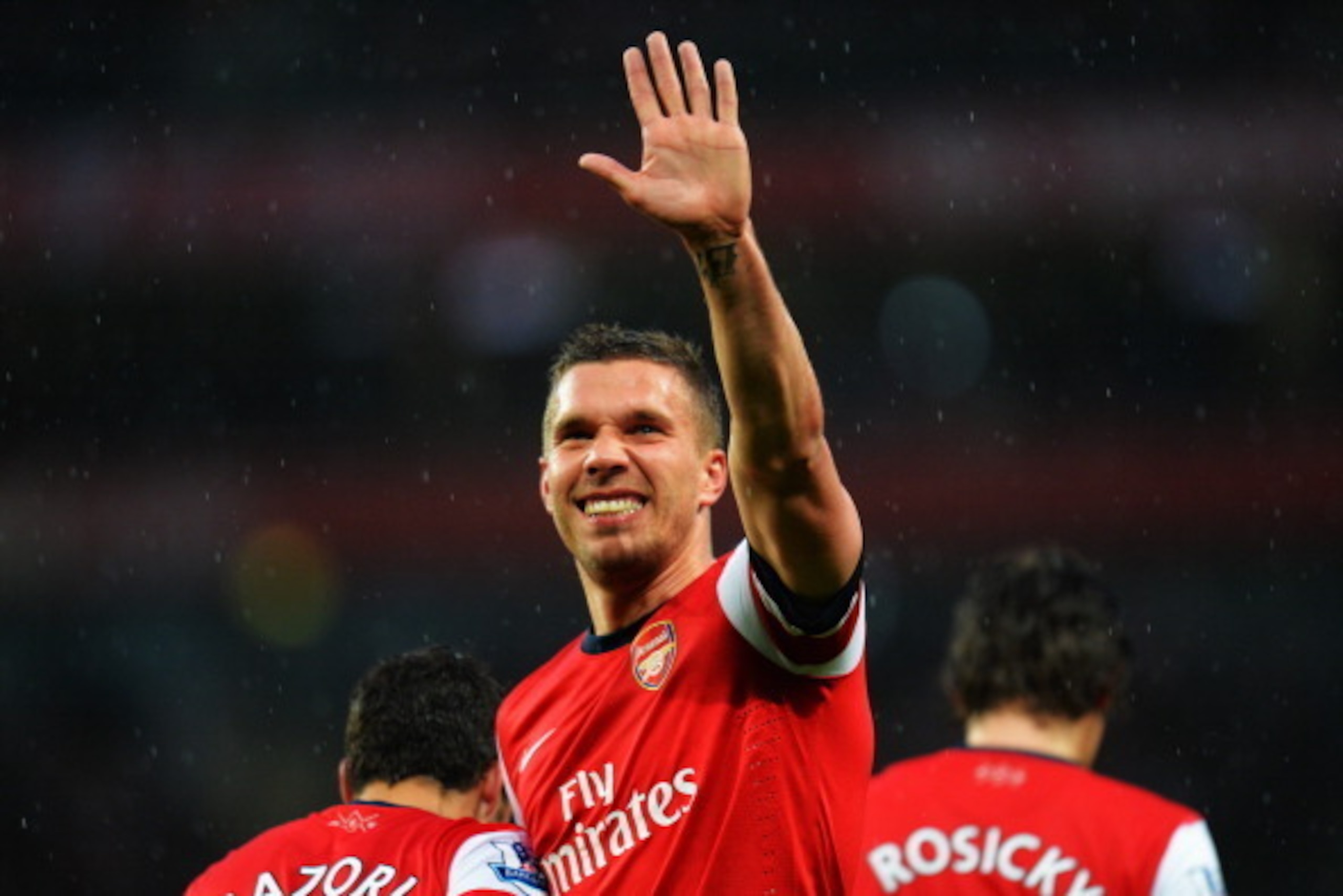 LONDON, ENGLAND - MAY 14:  Lukas Podolski of Arsenal celebrates scoring during the Barclays Premier League match between Arsenal and Wigan Athletic at Emirates Stadium on May 14, 2013 in London, England.  (Photo by Shaun Botterill/Getty Images)