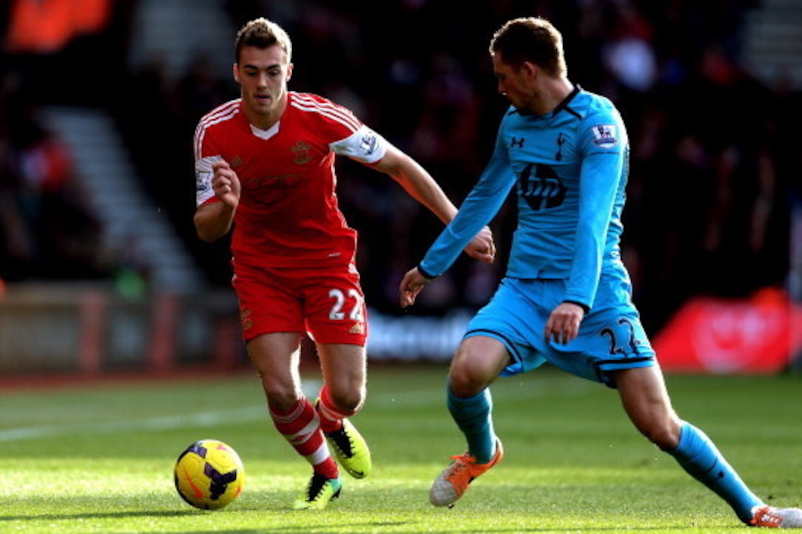 SOUTHAMPTON, ENGLAND - DECEMBER 22:  Calum Chambers of Southampton and Gylfi Sigurdsson of Spurs compete for the ball during the Barclays Premier League match between Southampton and Tottenham Hotspur at St Mary's Stadium on December 22, 2013 in Southampt