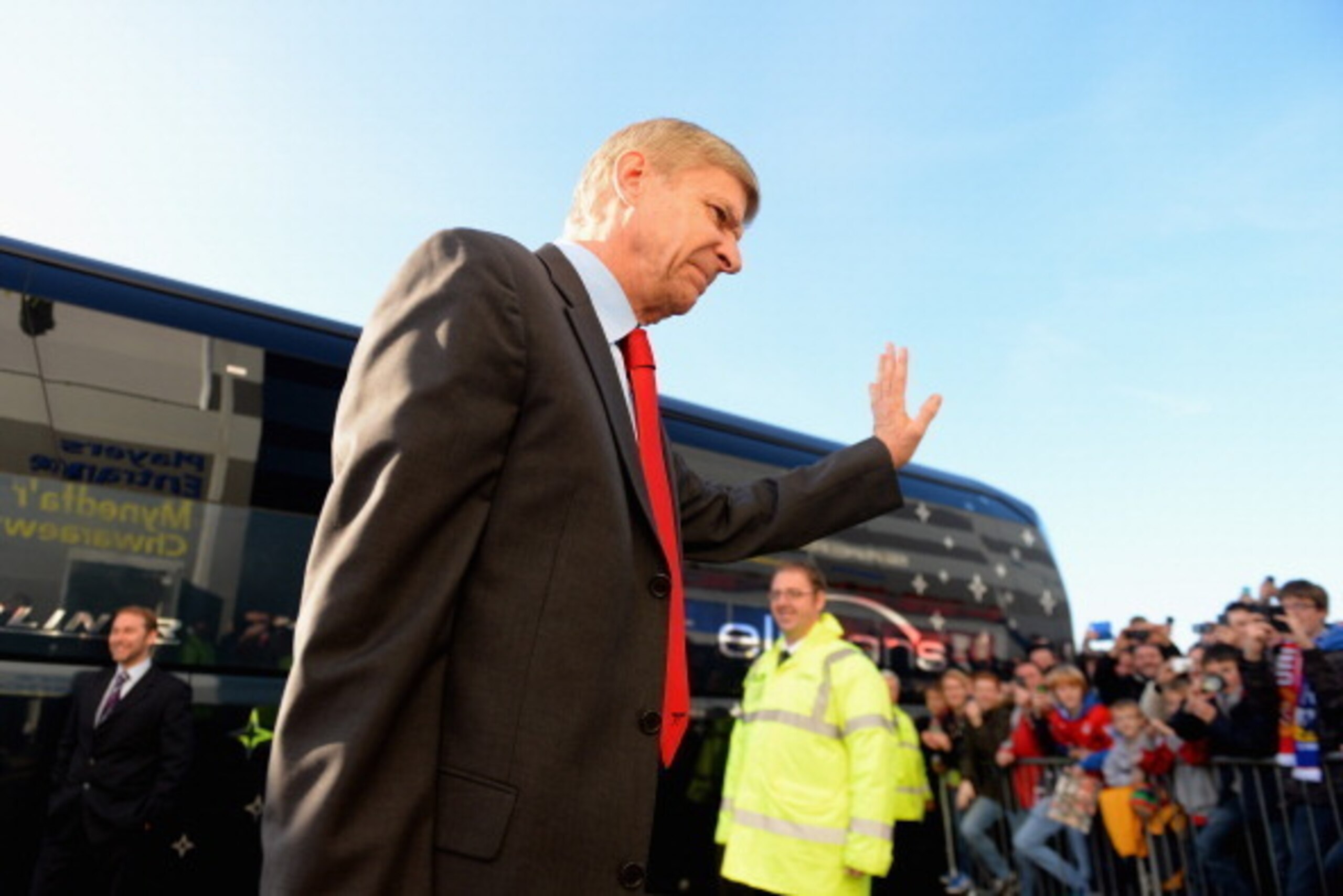 CARDIFF, WALES - NOVEMBER 30:  Manager Arsene Wenger of Arsenal acknowledges the fans as he arrives at Cardiff City during the Barclays Premier League match between Cardiff City and Arsenal at Cardiff City Stadium on November 30, 2013 in Cardiff, Wales.  